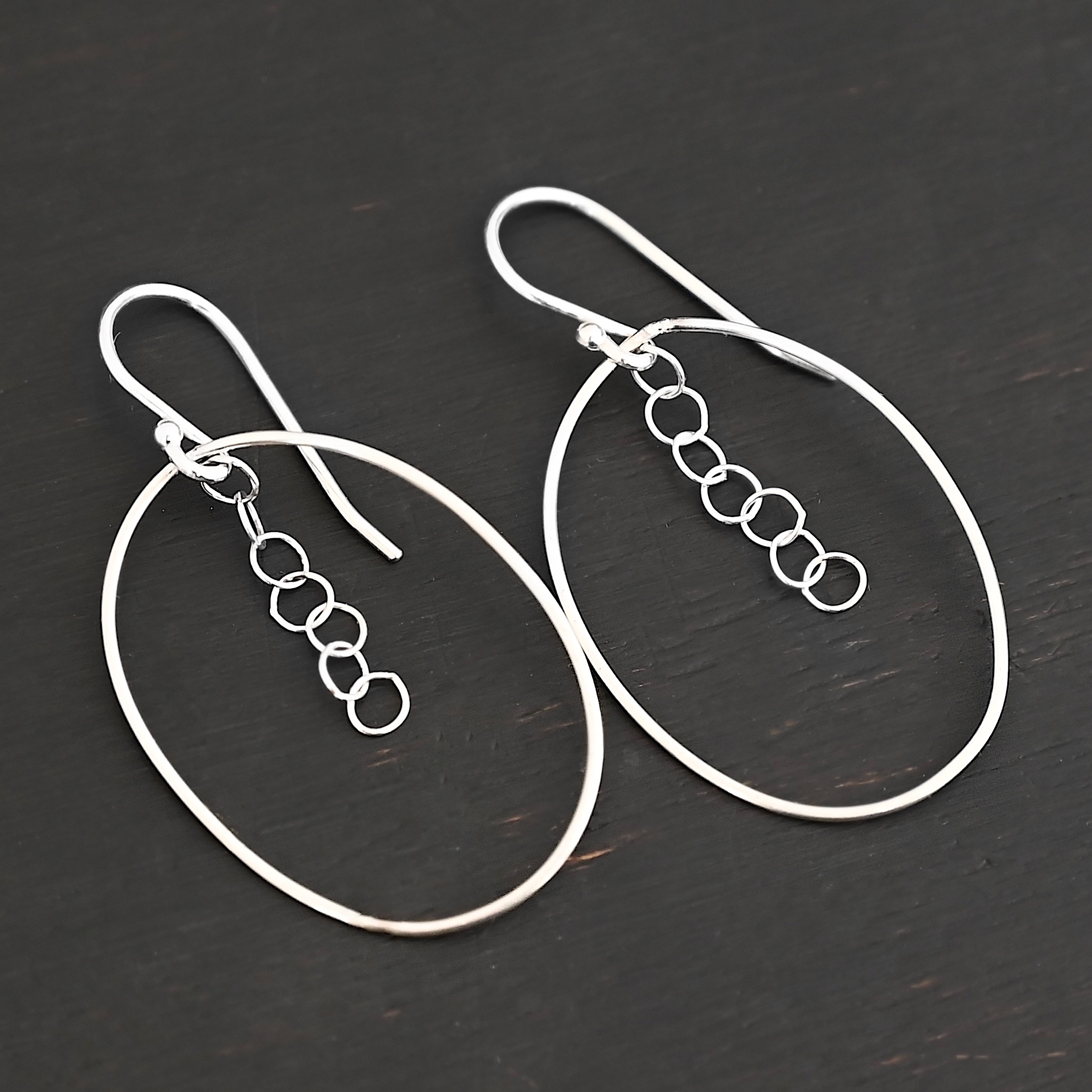 Sterling Silver Farah Chandelier Earring shiny shown on dark background