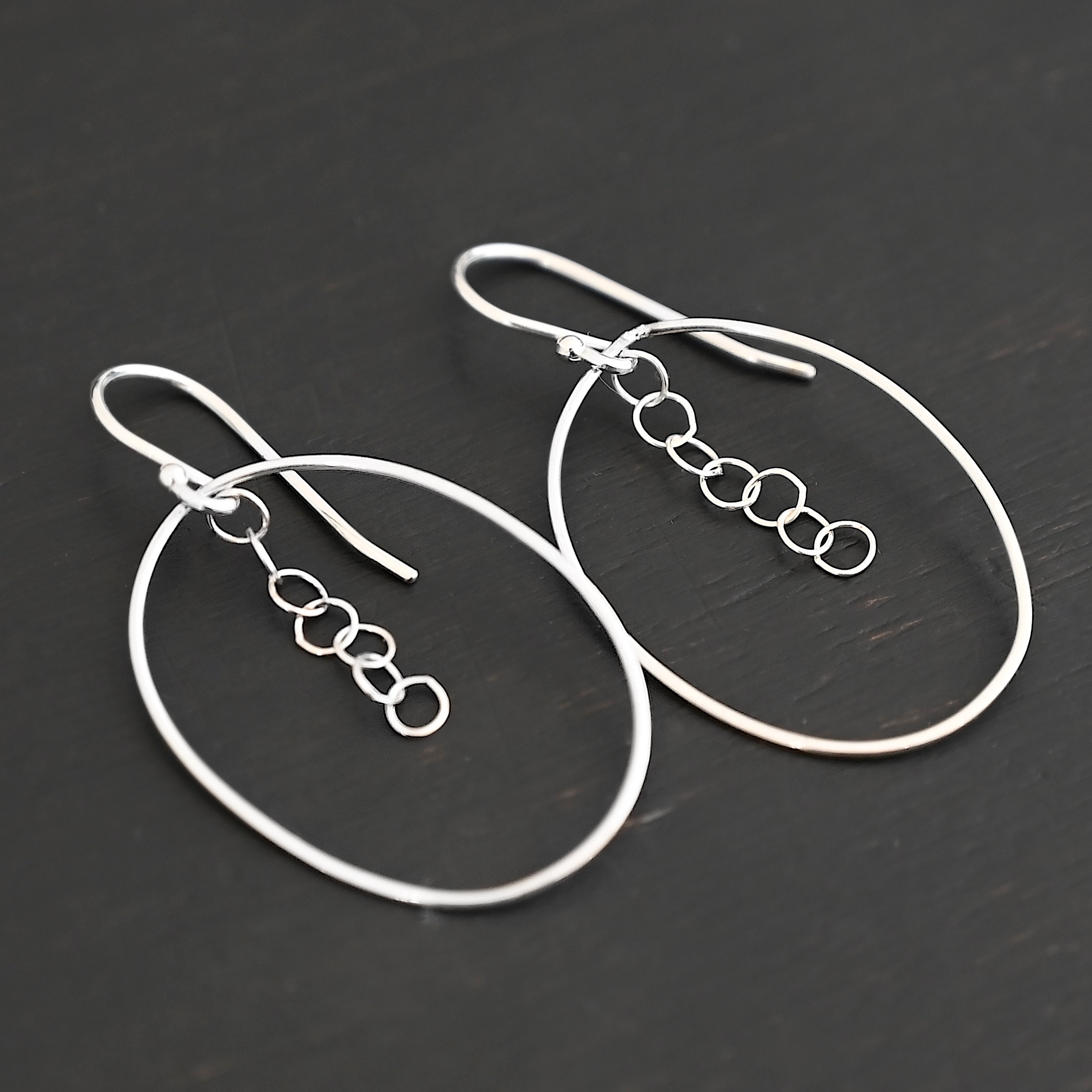 Sterling Silver Farah Chandelier Earring shiny shown on dark background