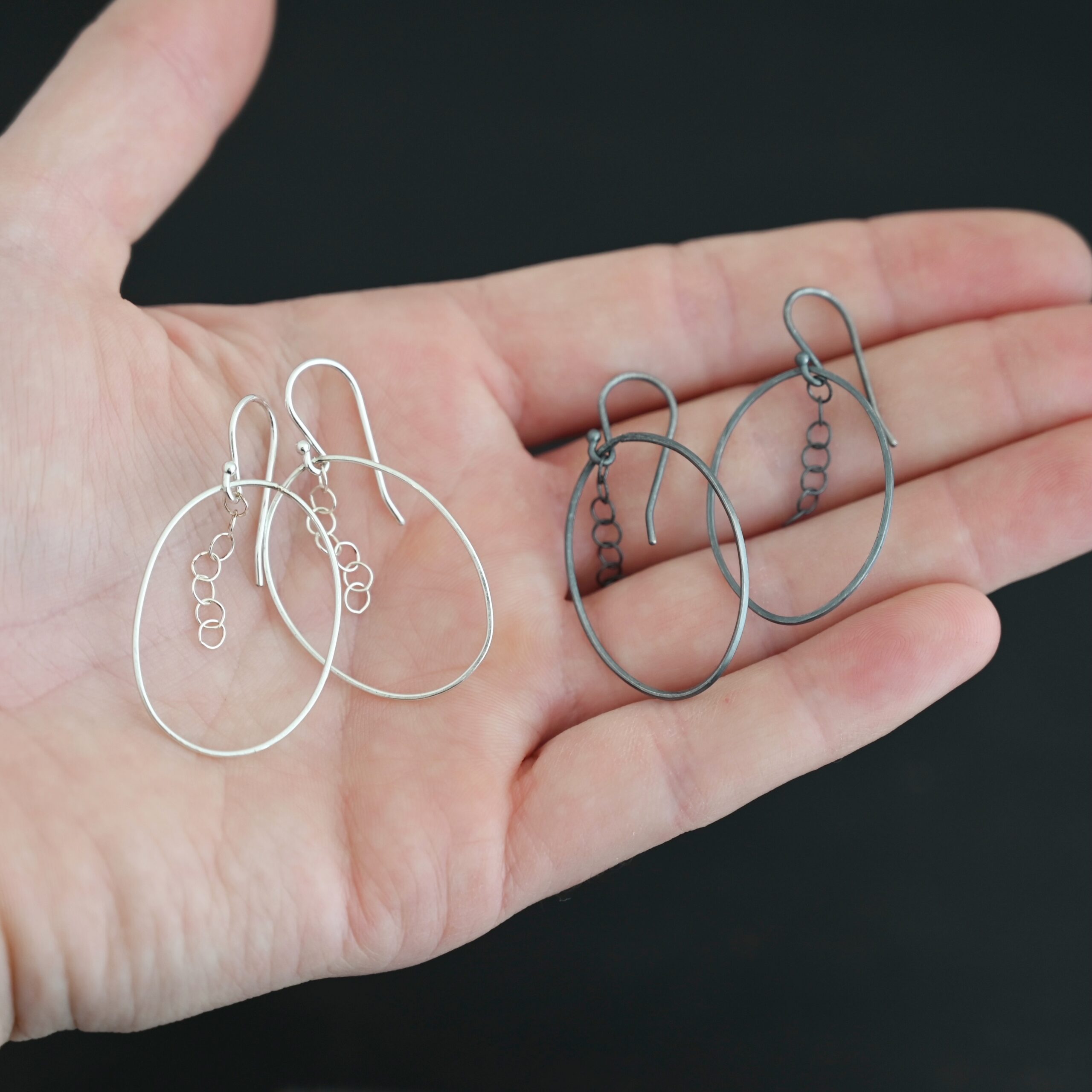 Sterling Silver Farah Chandelier Earring oxidized and shiny shown in hand