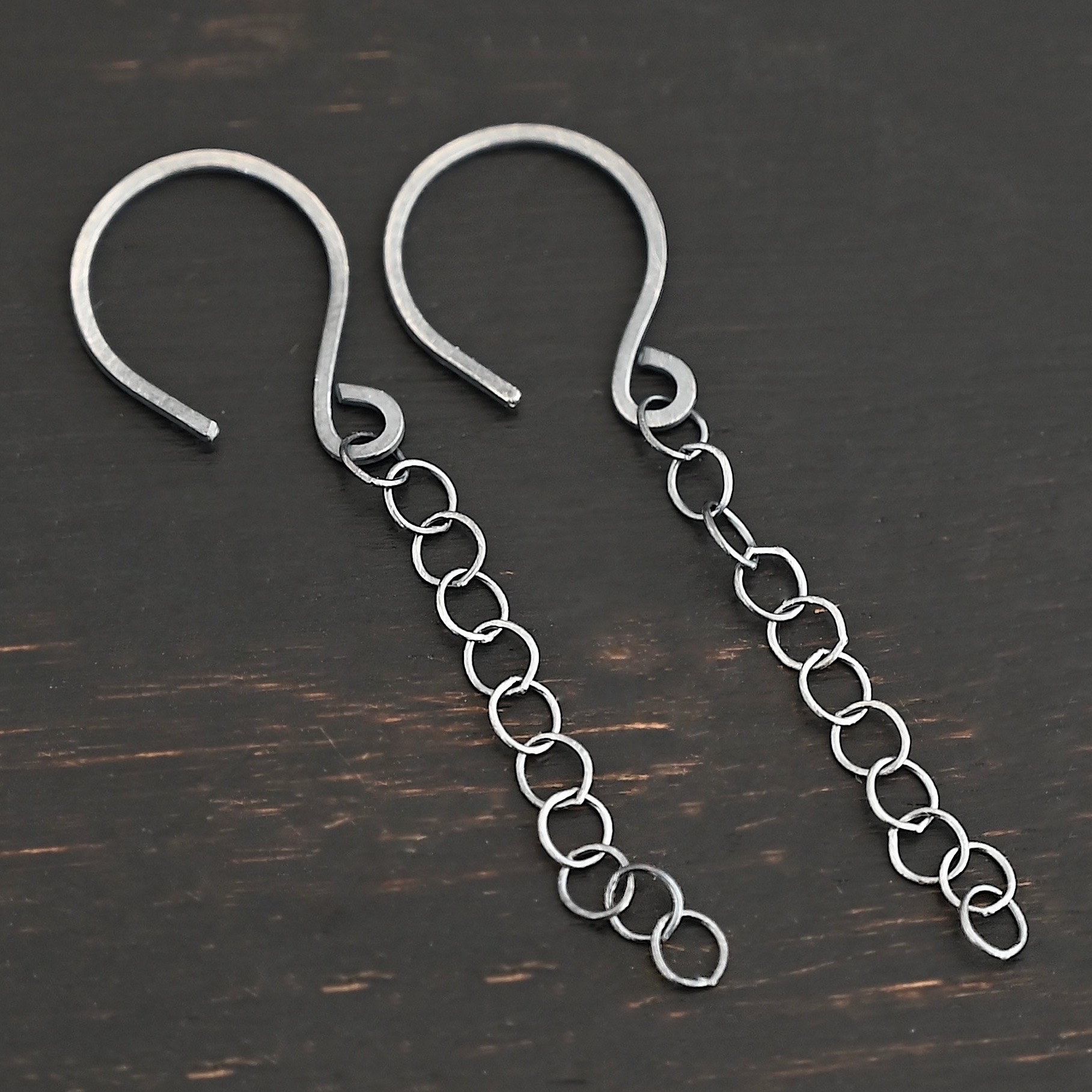 Sterling Silver Fay Dangle Earrings oxidized shown on dark background