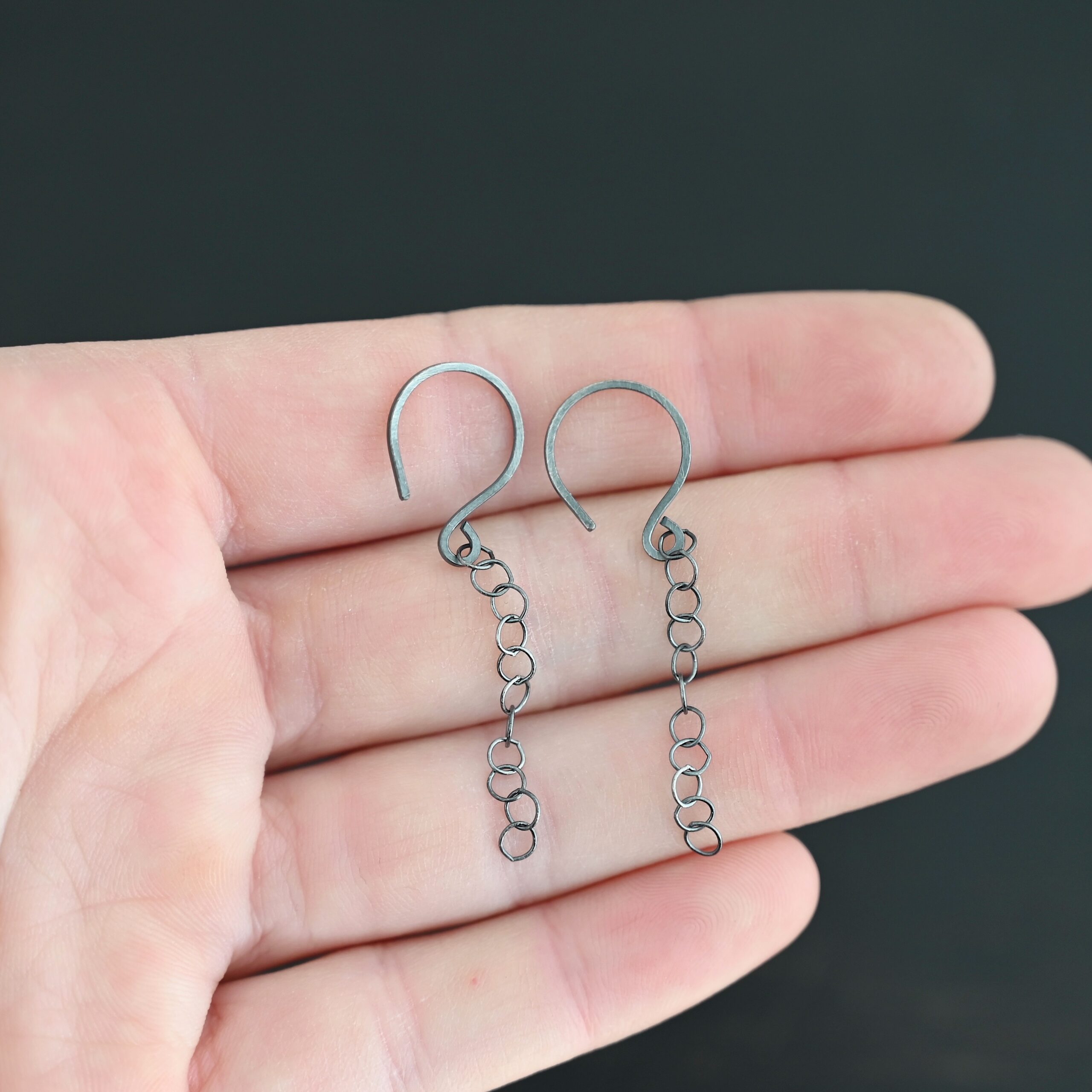 Sterling Silver Fay Dangle Earrings oxidized shown in hand