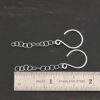 Sterling Silver Fay Dangle Earrings shiny shown by ruler