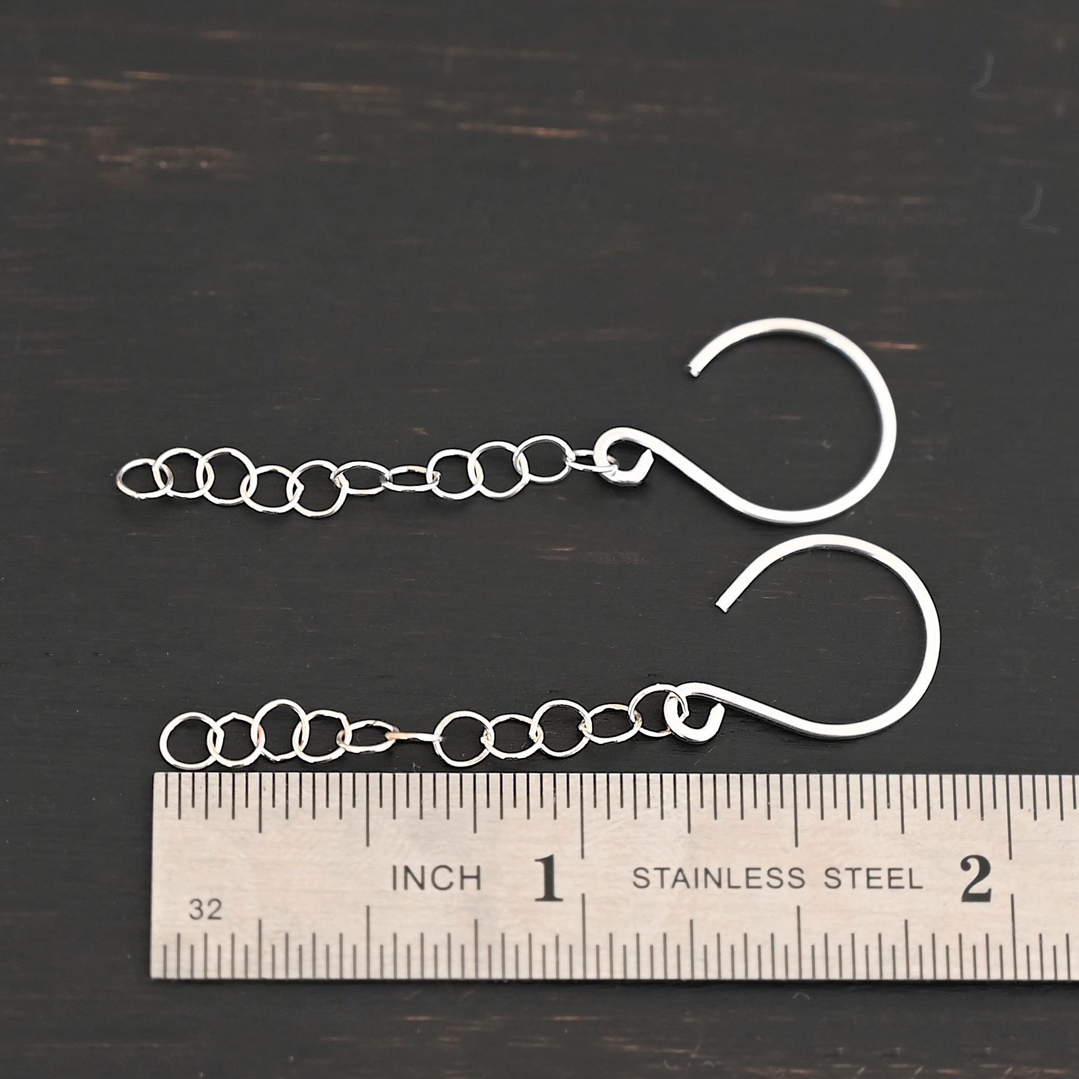 Sterling Silver Fay Dangle Earrings shiny shown by ruler