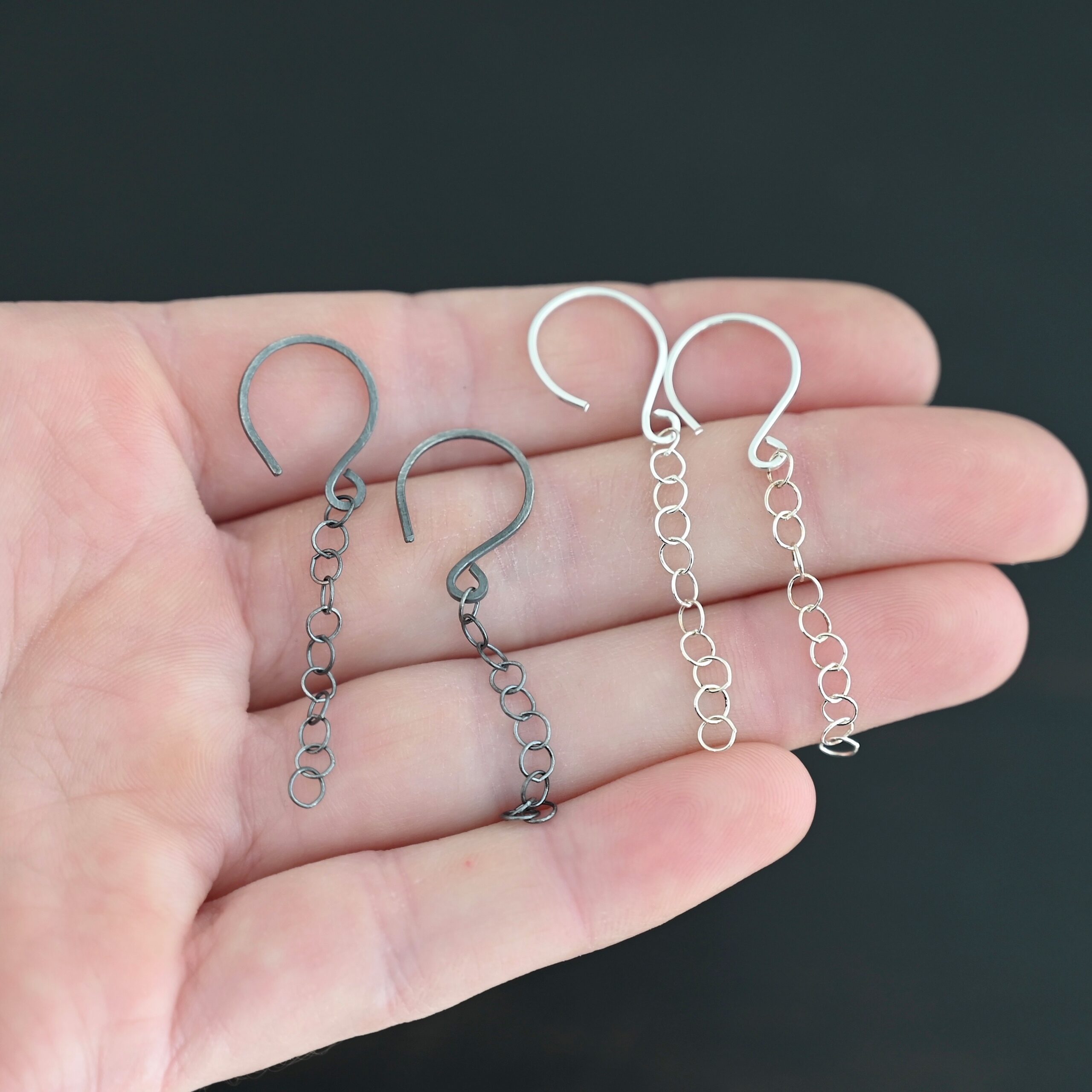 Sterling Silver Fay Dangle Earrings shiny and oxidized shown in hand