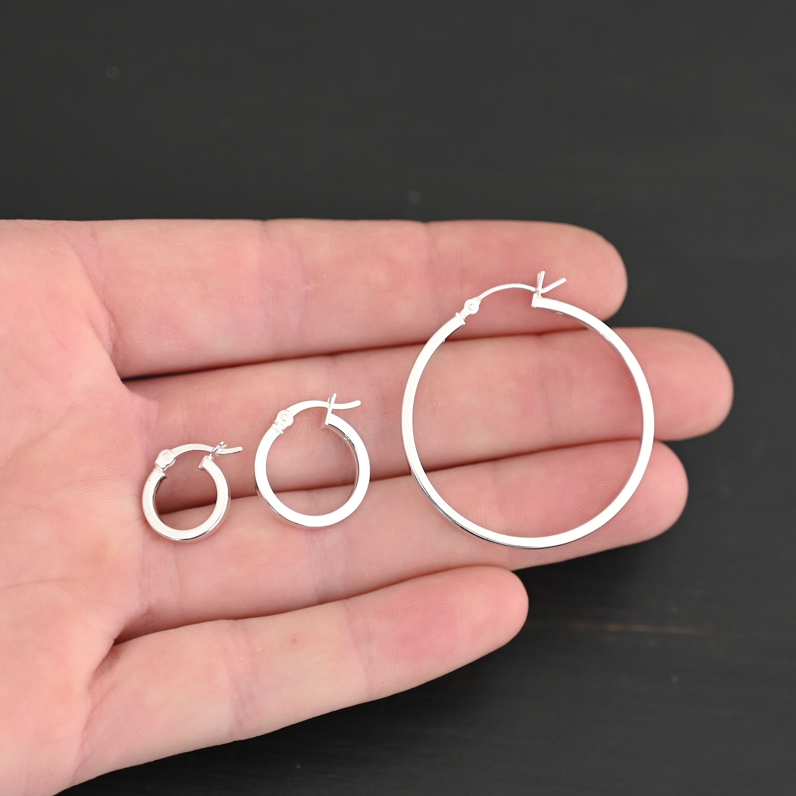 Sterling Silver Frankie Square Hoop Earrings all sizes shiny shown in hand