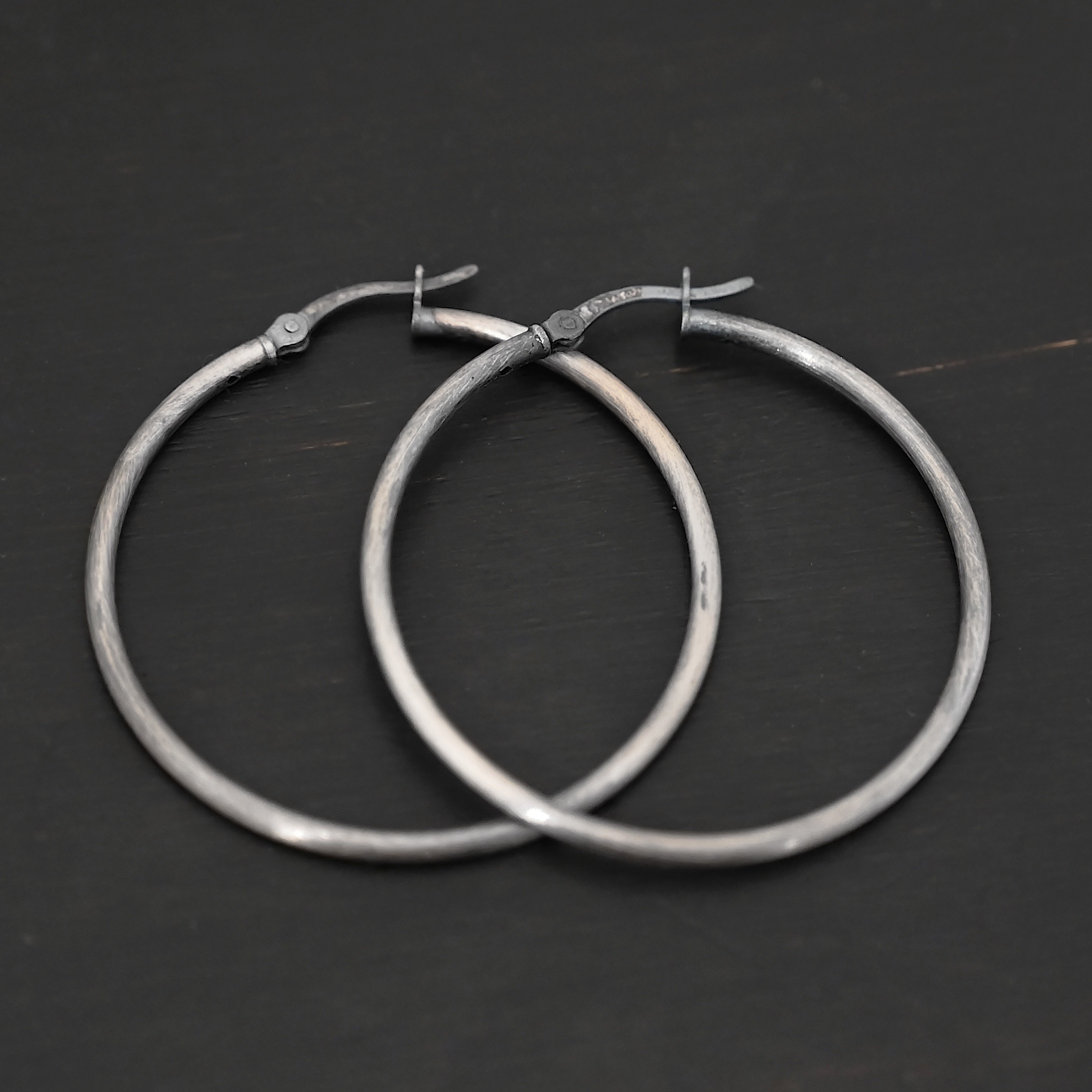 Francesca Hoops 40mm oxidized Sterling Silver Francesca Hoops 40mm oxidized shown on dark background