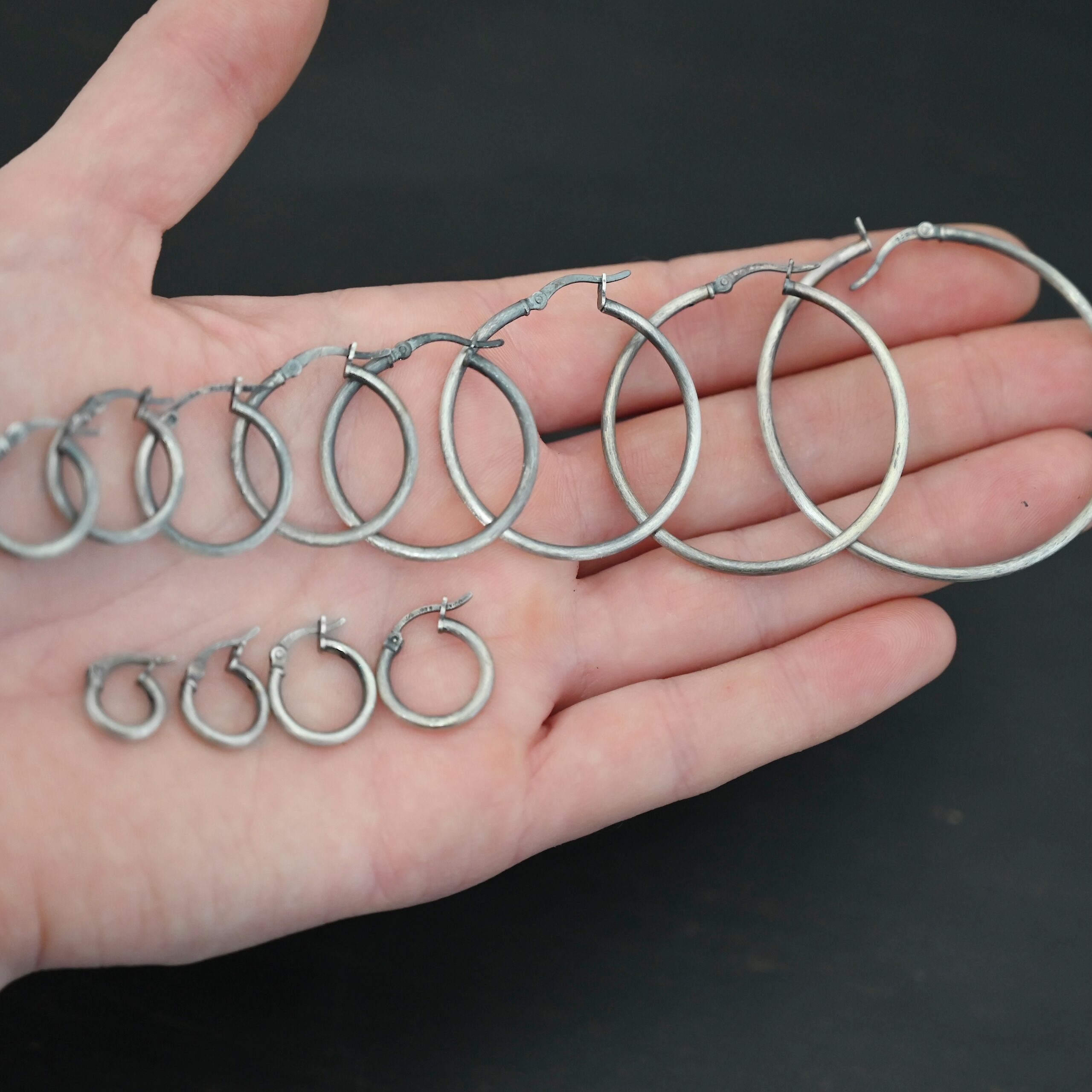 Francesca Hoops all sizes oxidized Sterling Silver Francesca Hoops all sizes oxidized shown in hand