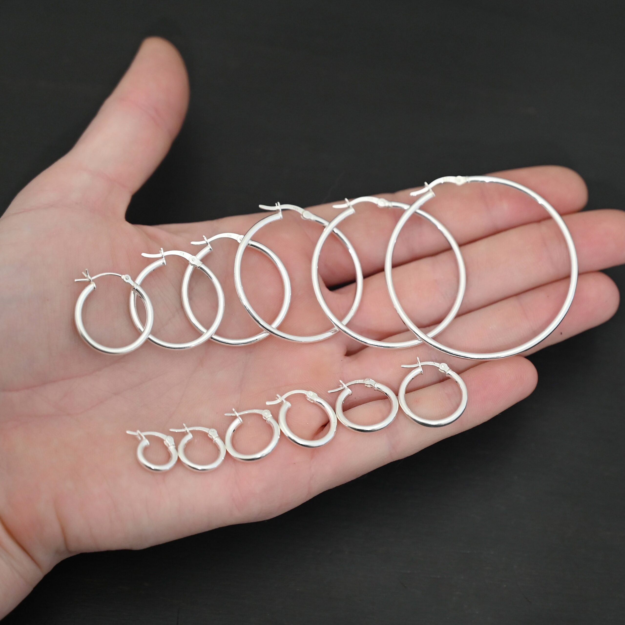 Francesca Hoops all sizes shiny Sterling Silver Francesca Hoops all sizes shiny shown in hand