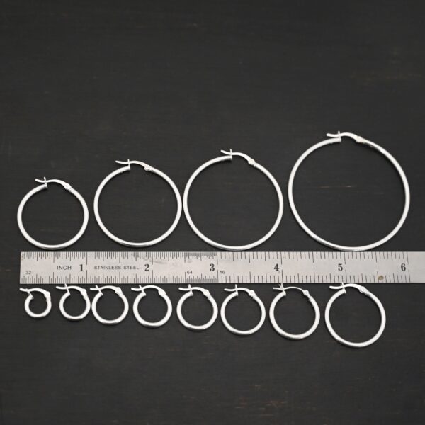 Sterling Silver Francesca Hoops all sizes shiny shown by ruler