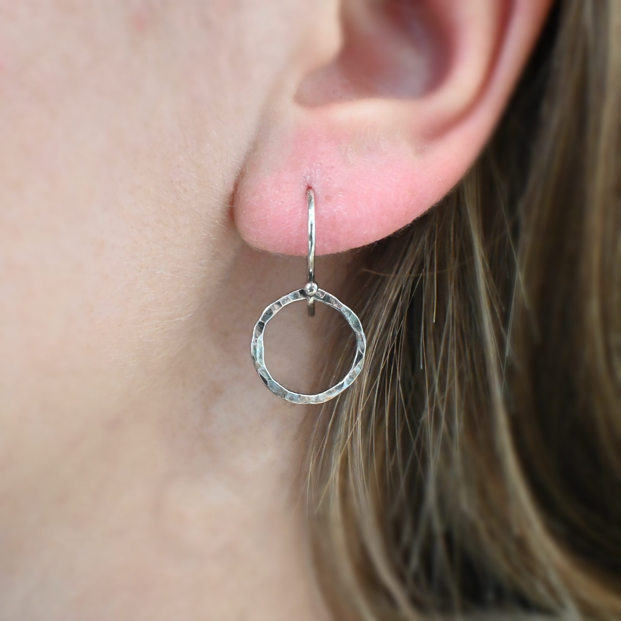 Sterling Silver Fawna Hammered Circle Earrings oxidized shown on model