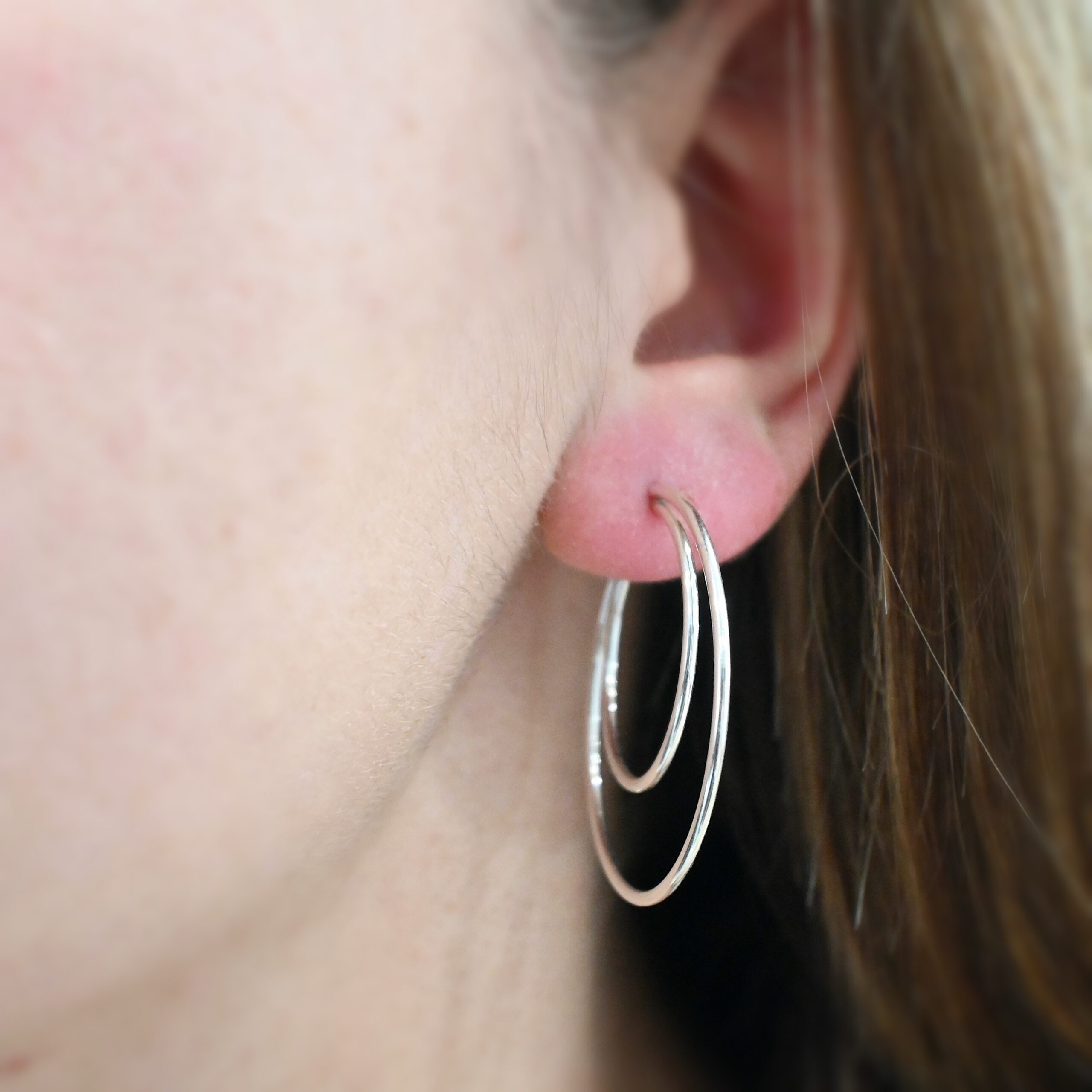 Sterling Silver Fern Double Hoop Earrings 35mm shiny shown on model