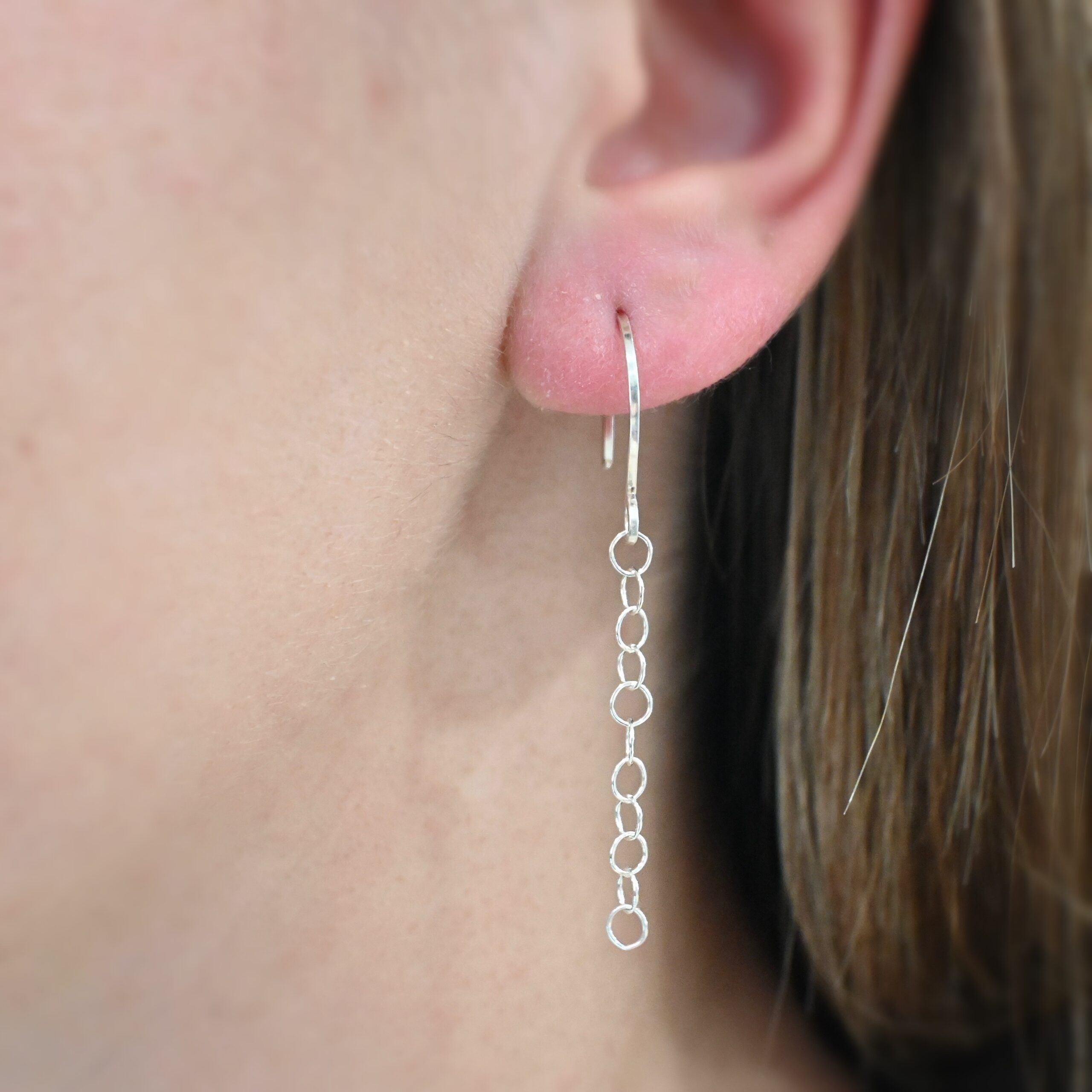 Sterling Silver Fay Dangle Earrings shiny shown on model