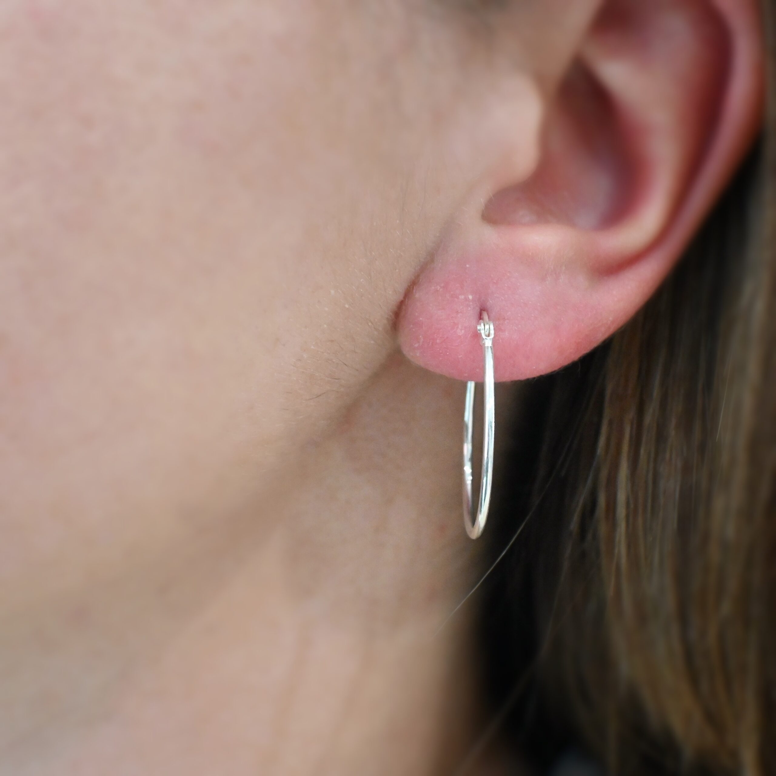 Sterling Silver Fiona Hoop Earrings shiny shown on model