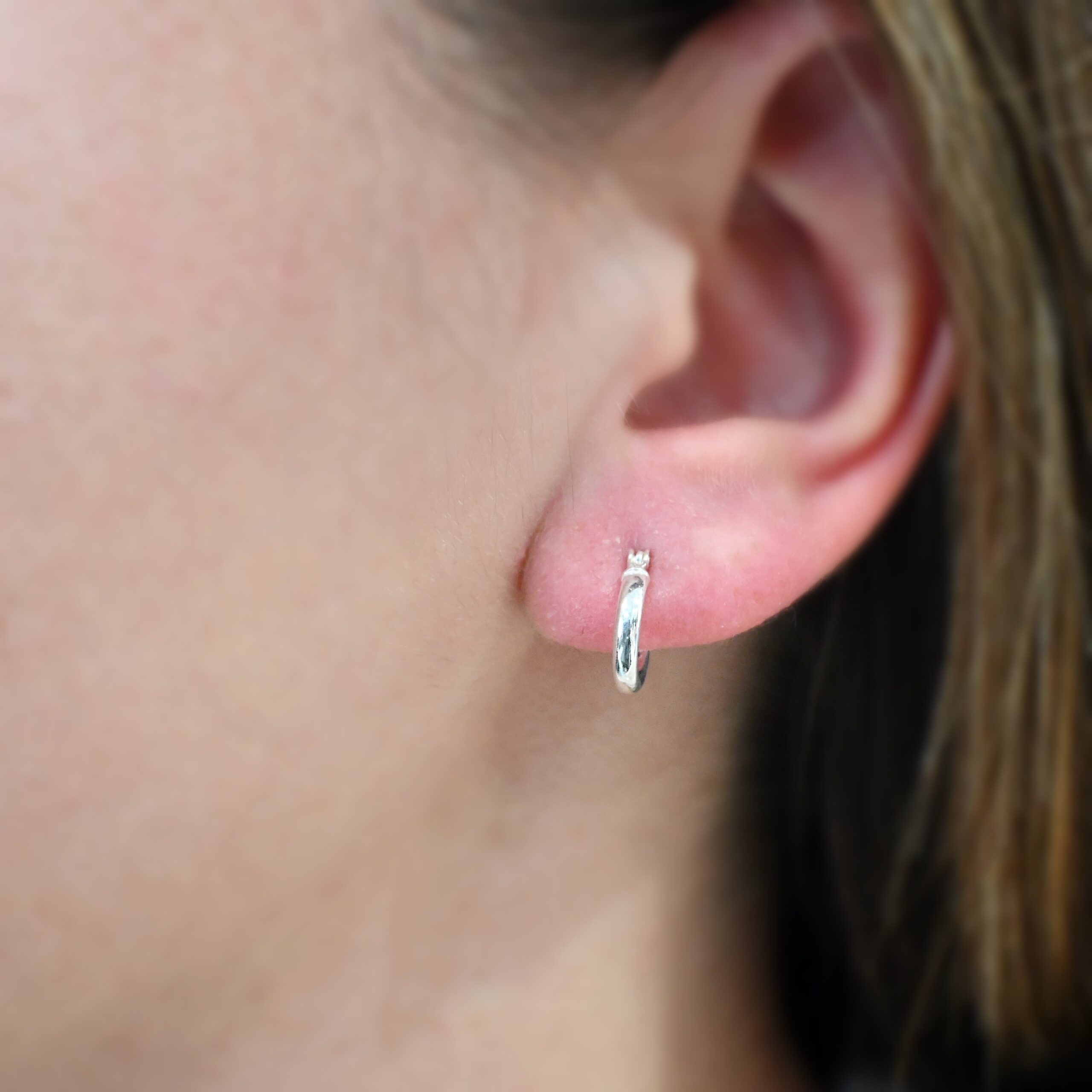 Francesca Hoops 10mm shiny Sterling Silver Francesca Hoops 10mm shiny shown on model