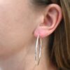 Sterling Silver Francesca Hoops 50mm shiny shown on model