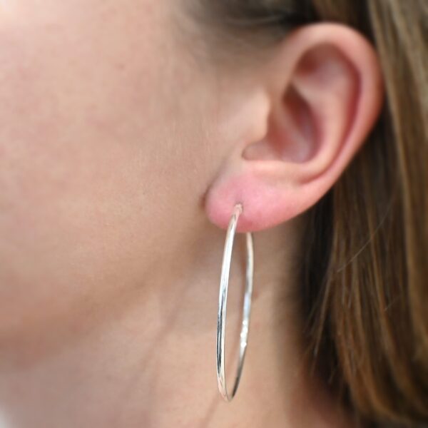 Sterling Silver Francesca Hoops 50mm shiny shown on model