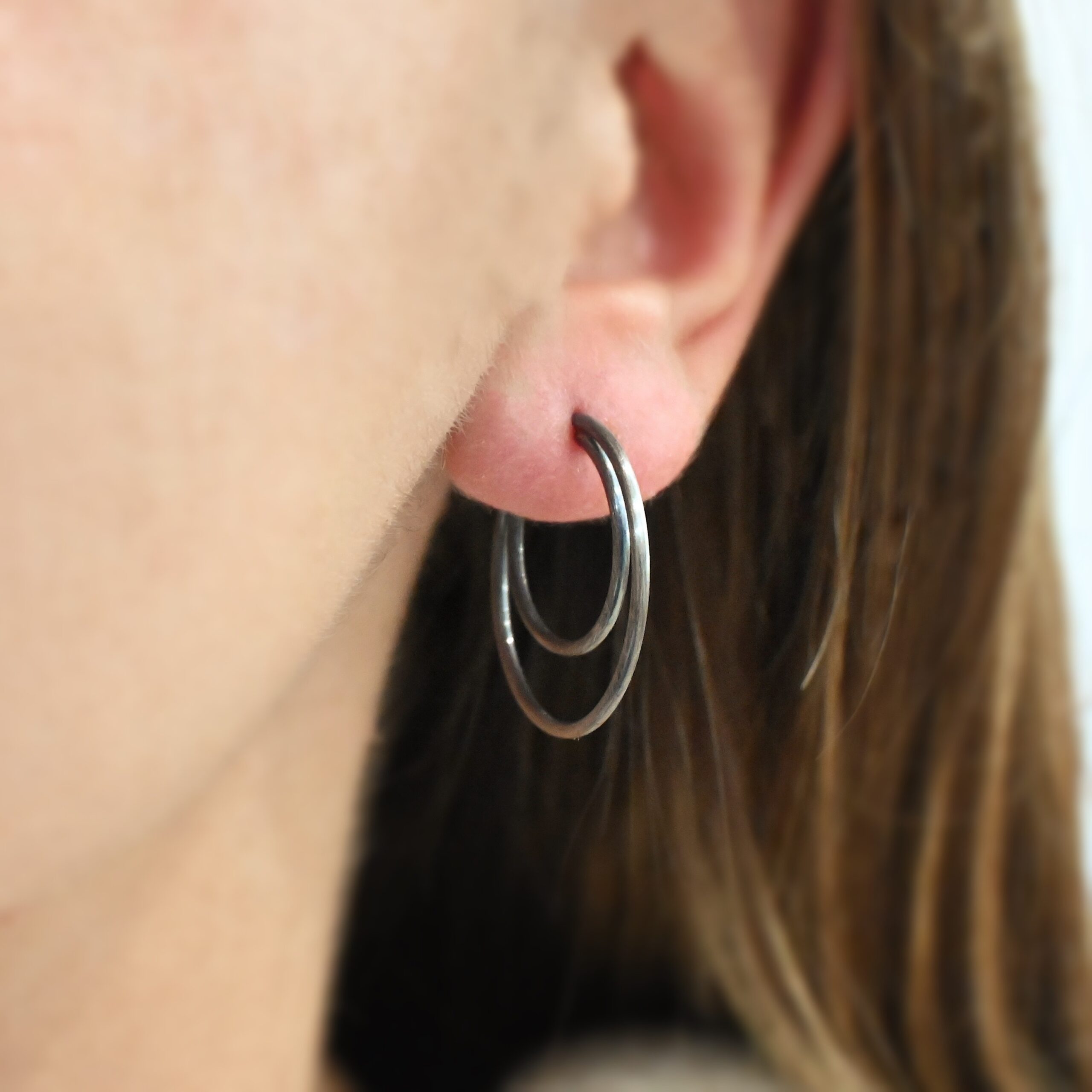 Sterling Silver Fern Double Hoop Earrings 25mm oxidized shown on model