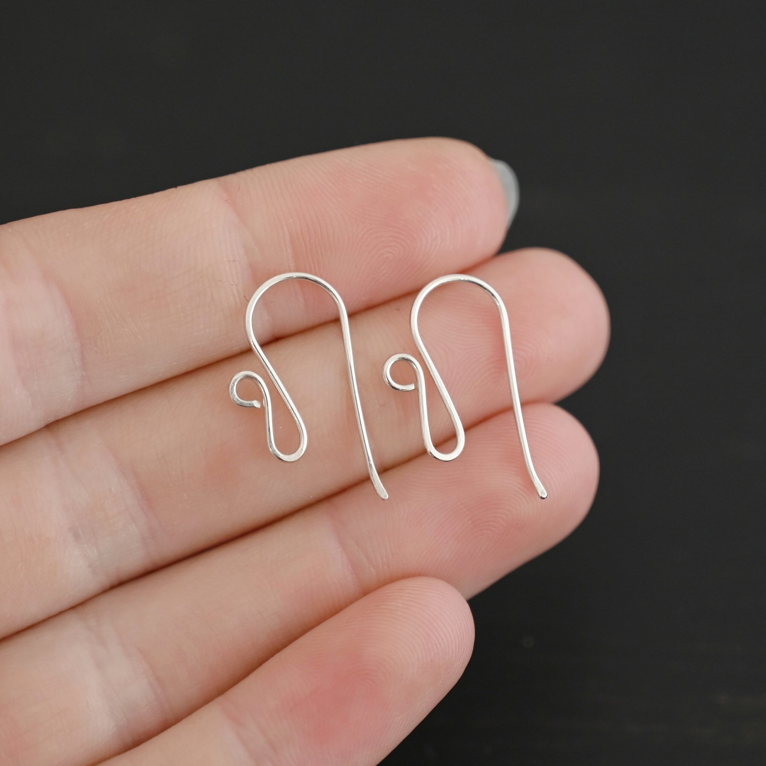 sterling silver Woodlyn Ear Wire - shiny shown in hand