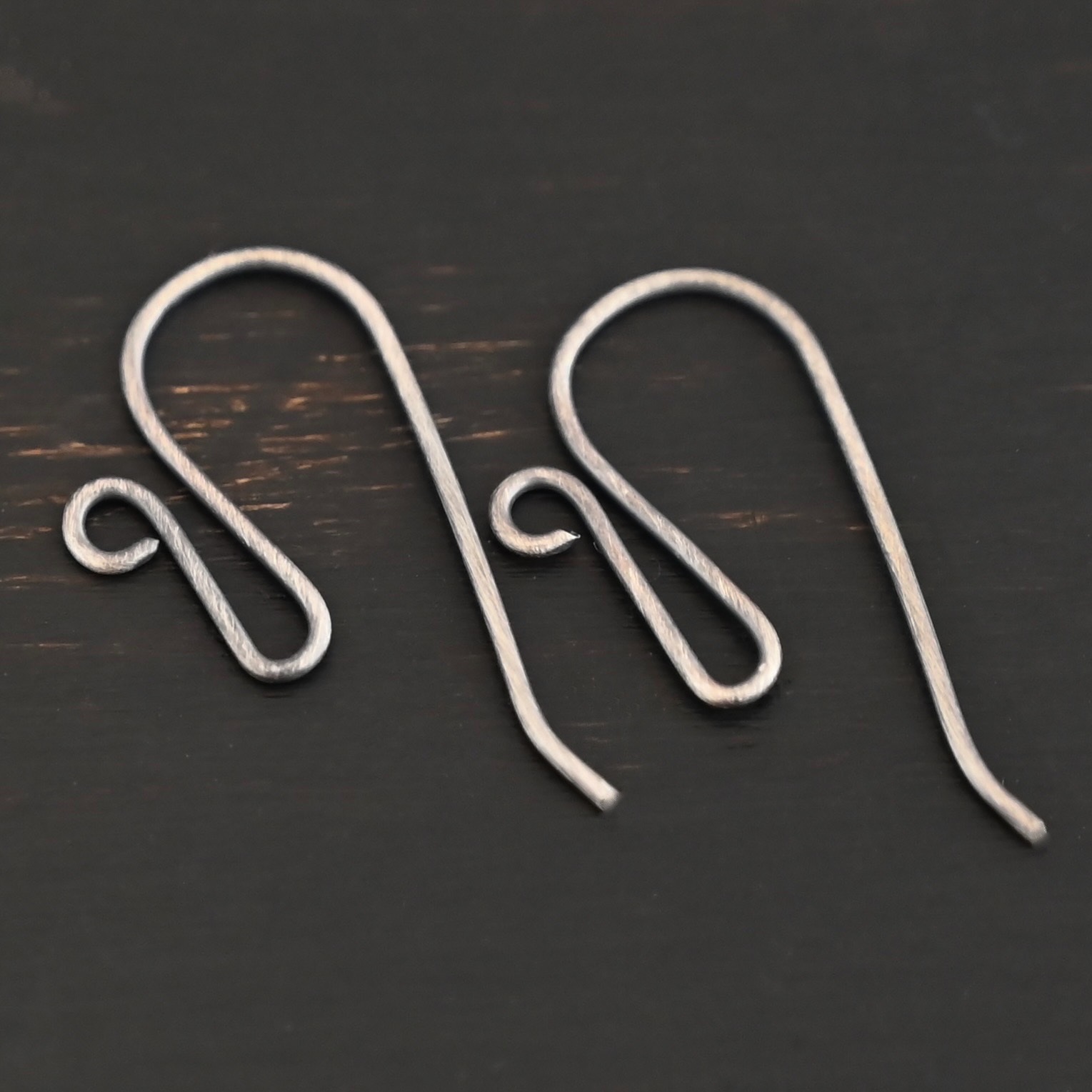 sterling silver Woodlyn Ear Wire - oxidized shown on dark background