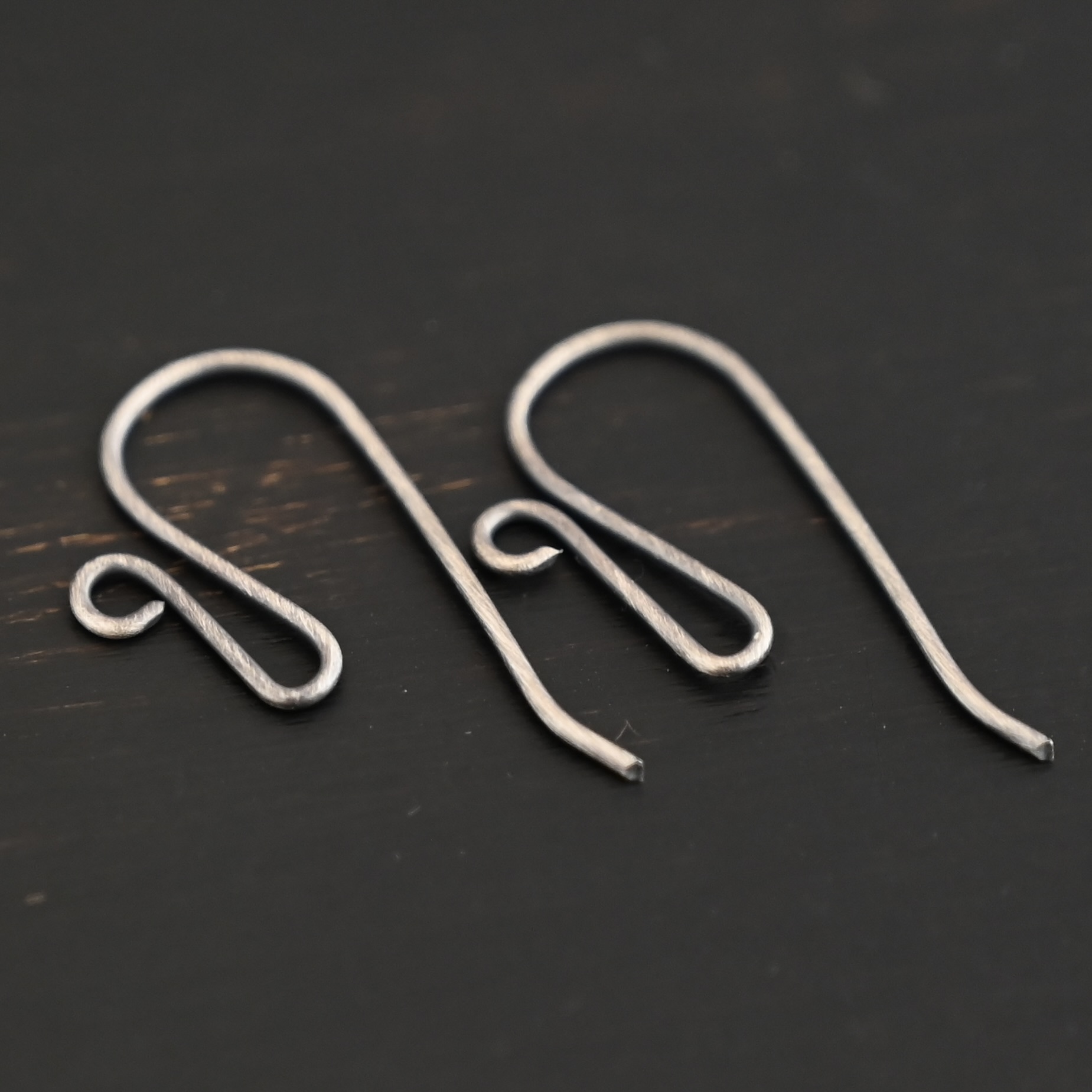 sterling silver Woodlyn Ear Wire - oxidized shown on dark background