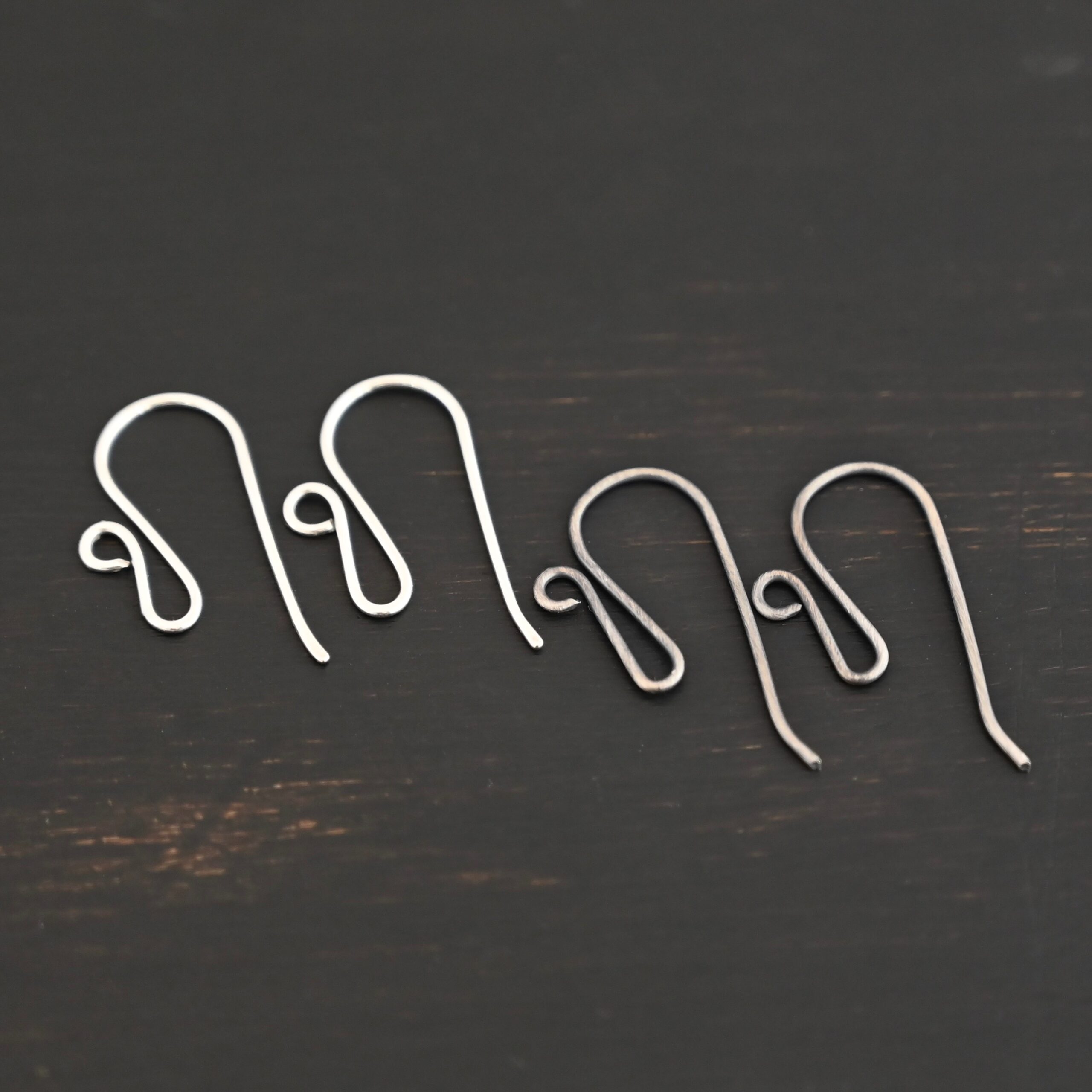 sterling silver Woodlyn Ear Wire - oxidized & shiny shown on dark background