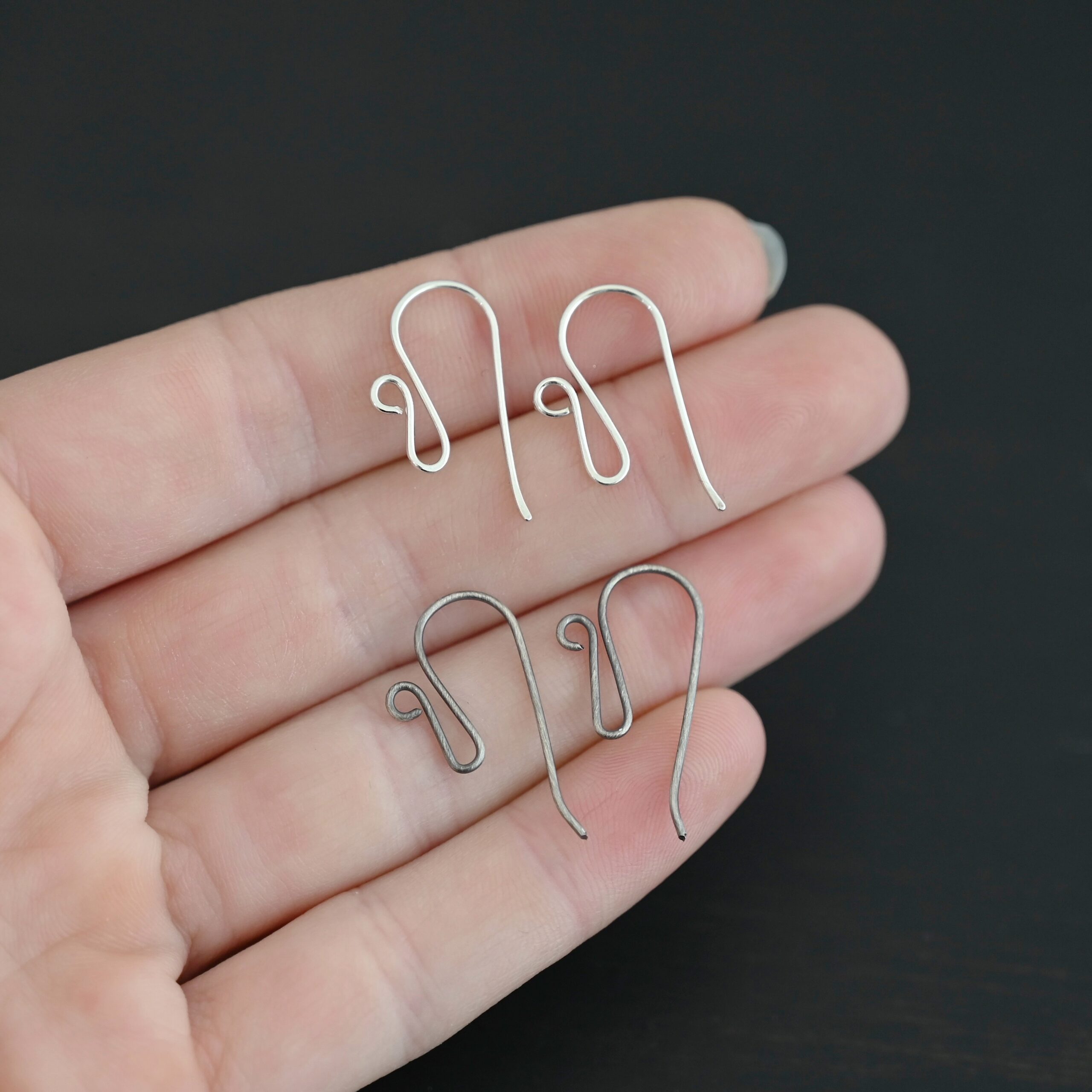 sterling silver Woodlyn Ear Wire - oxidized & shiny shown in hand