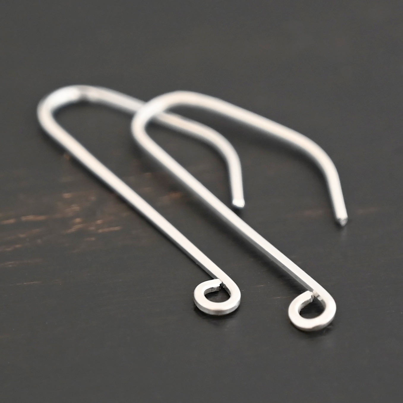 sterling silver Whimsical Ear Wire - shiny shown on dark background