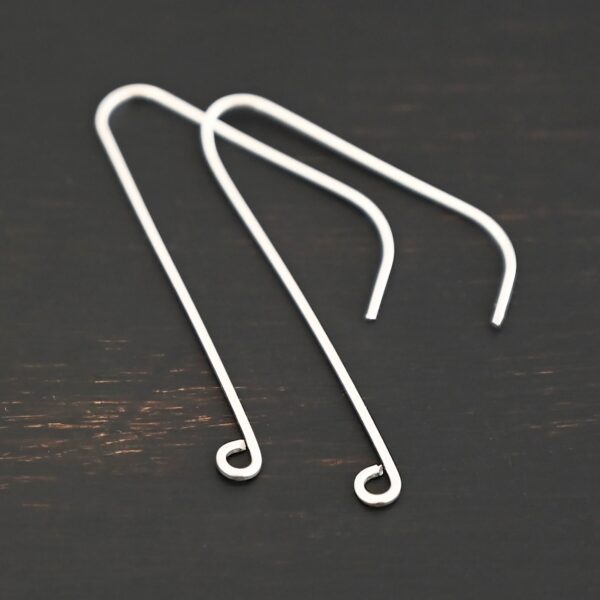 sterling silver Whimsical Ear Wire - shiny 1.5" shown on dark background