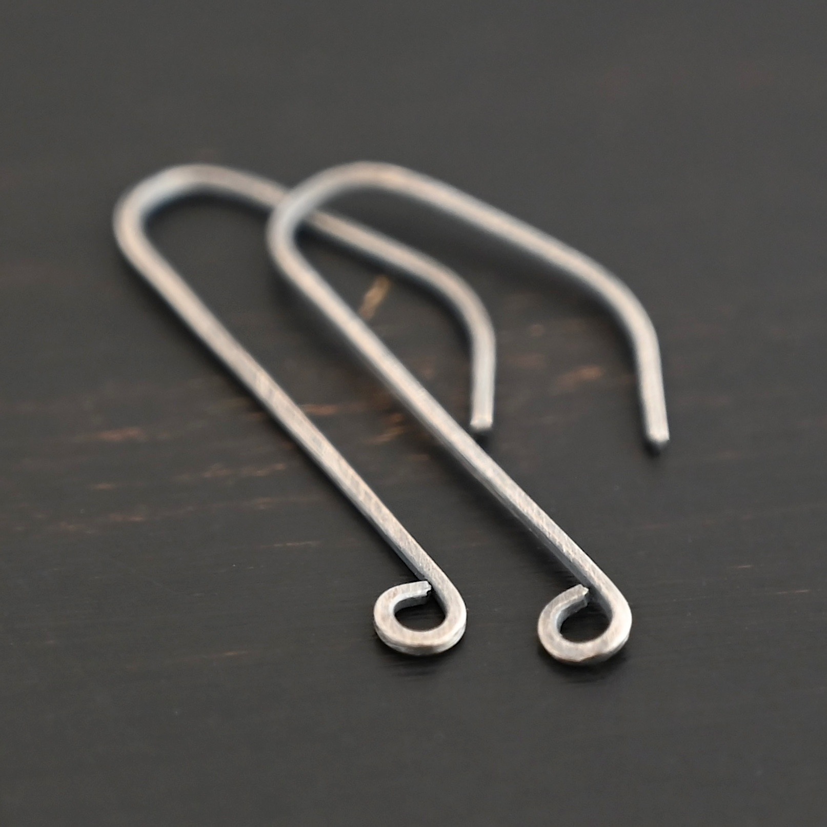 sterling silver Whimsical Ear Wire - oxidized shown on dark background