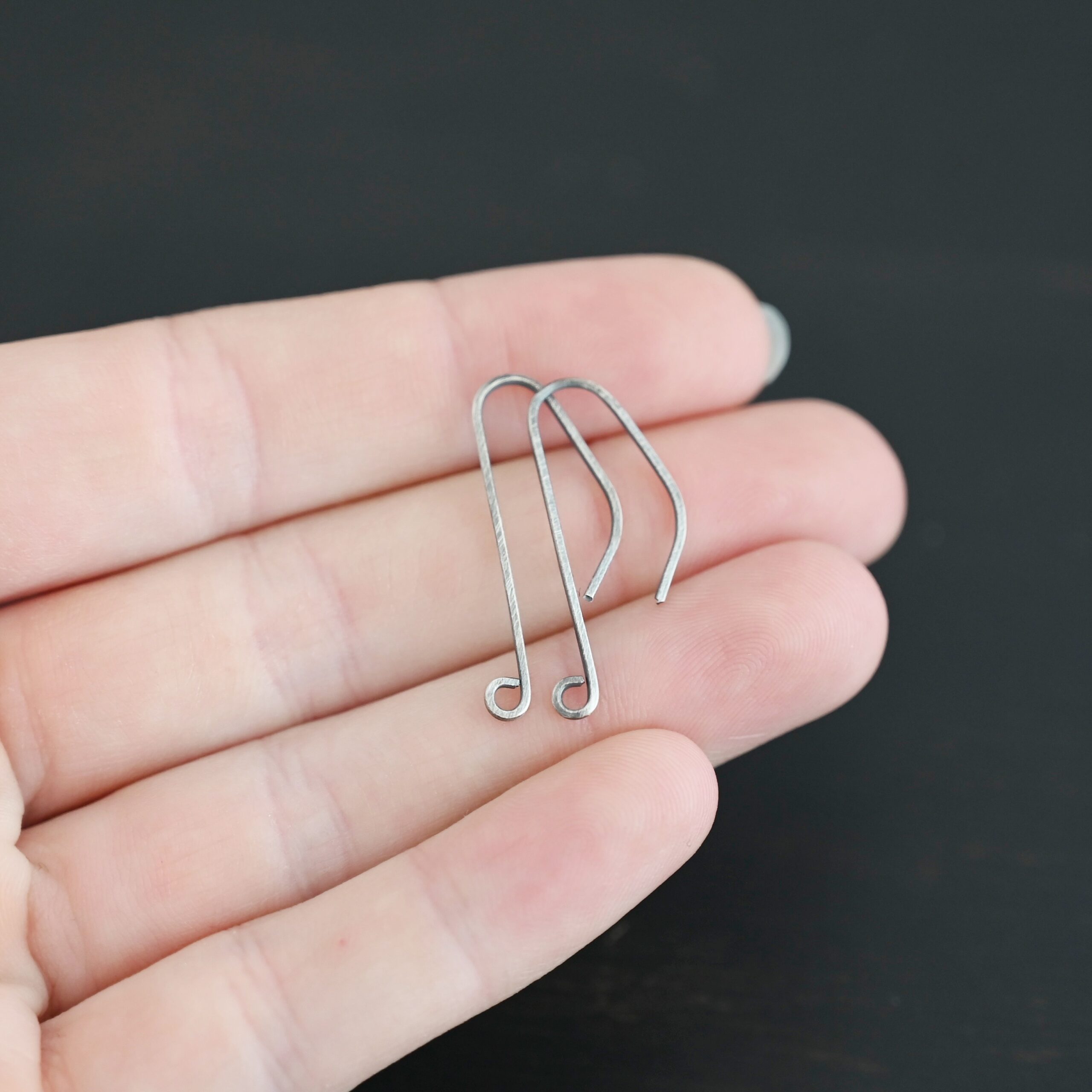 sterling silver Whimsical Ear Wire - oxidized 1" shown in hand