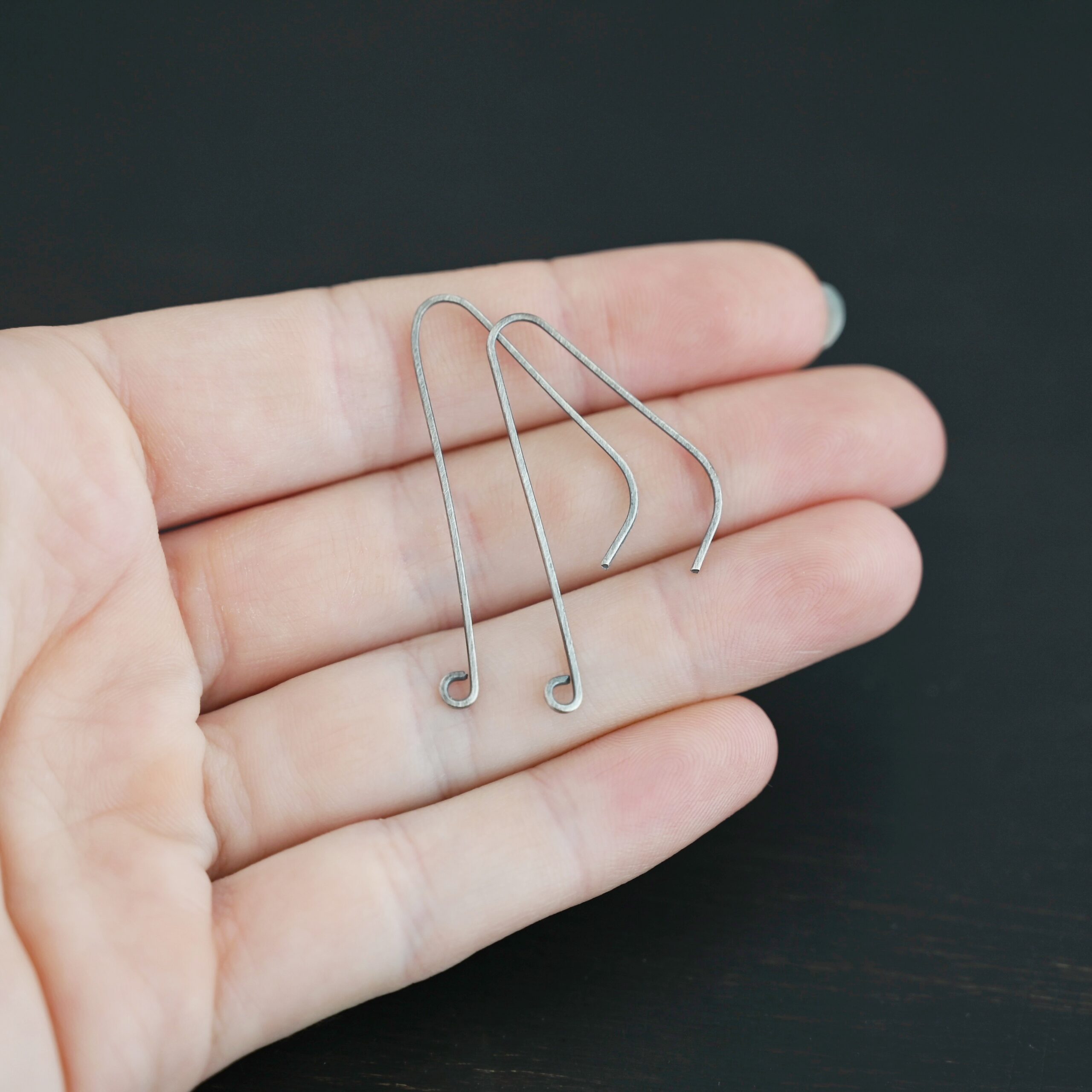 sterling silver Whimsical Ear Wire - oxidized 1.5" shown in hand