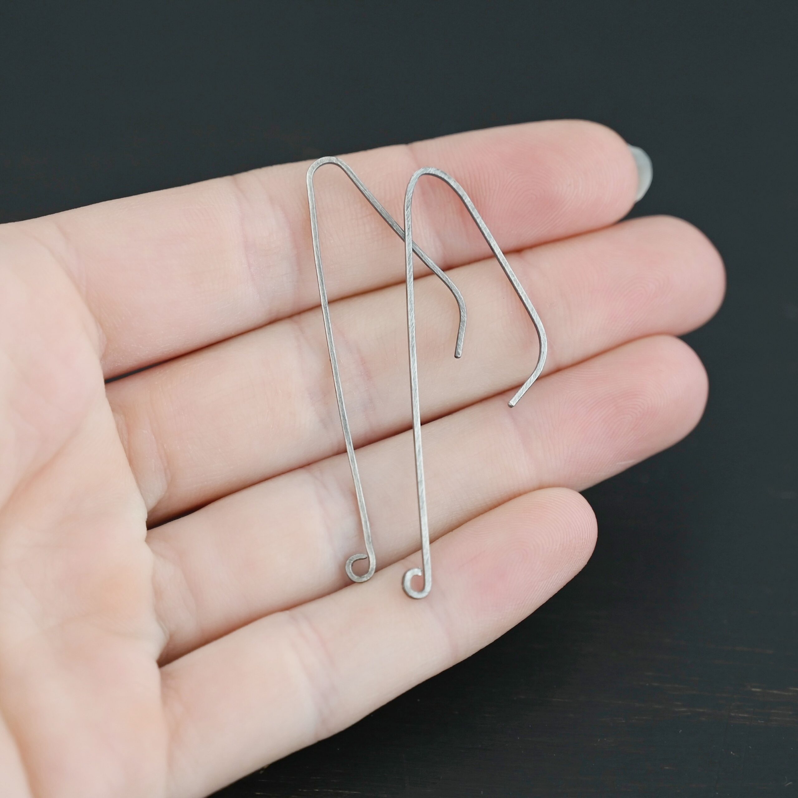 sterling silver Whimsical Ear Wire - oxidized 2" shown in hand