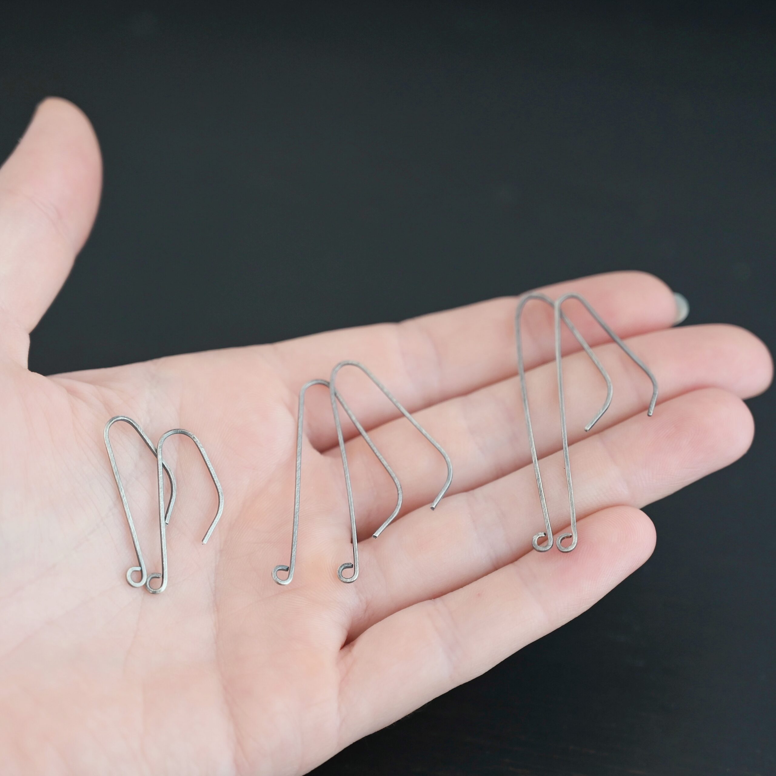 sterling silver Whimsical Ear Wire - oxidized all sizes shown in hand