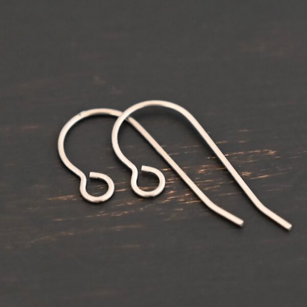 Wednesday Titanium Ear Wire - 23mm shown on dark background