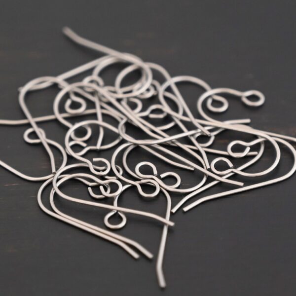 Wednesday Titanium Ear Wire - 23mm shown on dark background