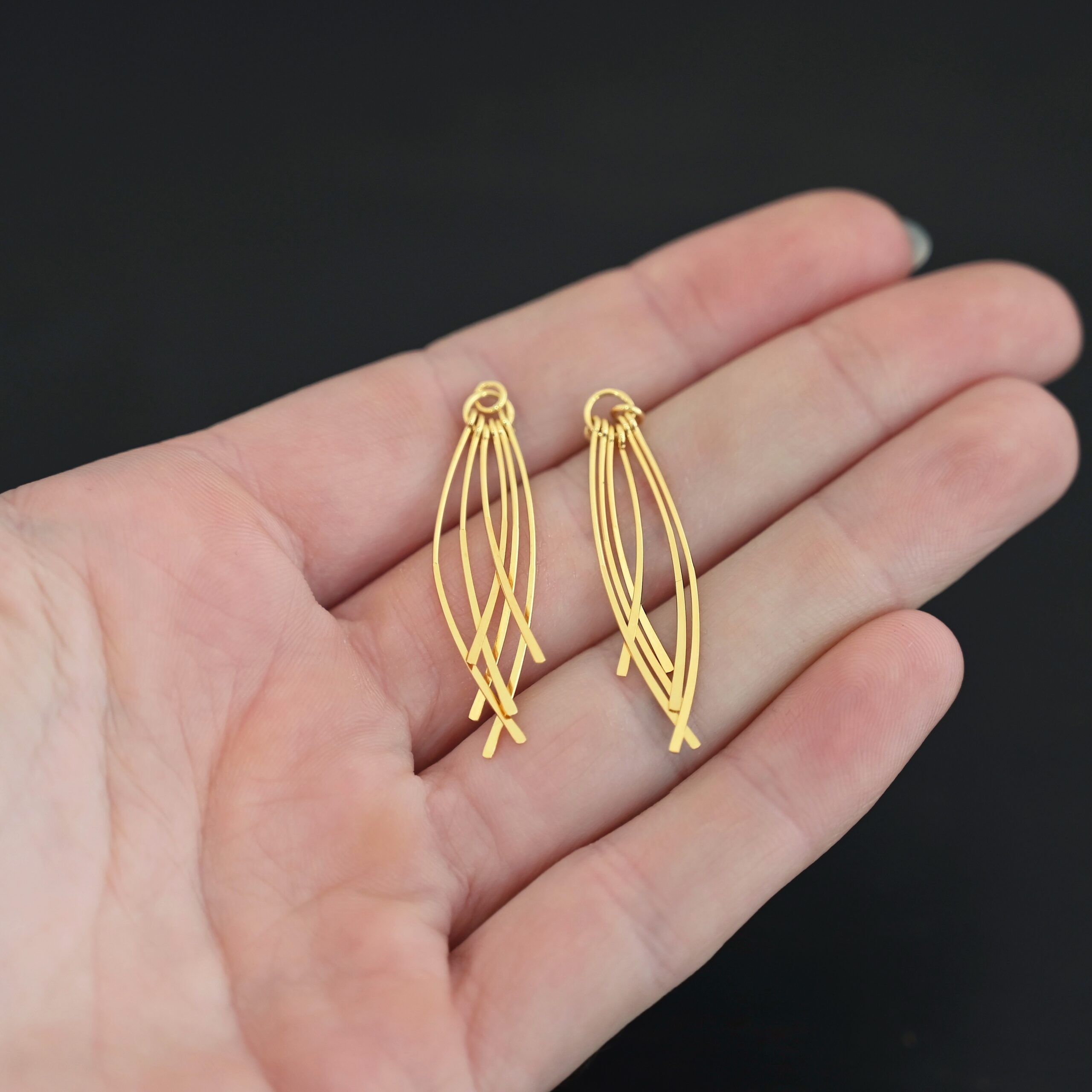 Topanga - Gold Plated Tassle shown in hand