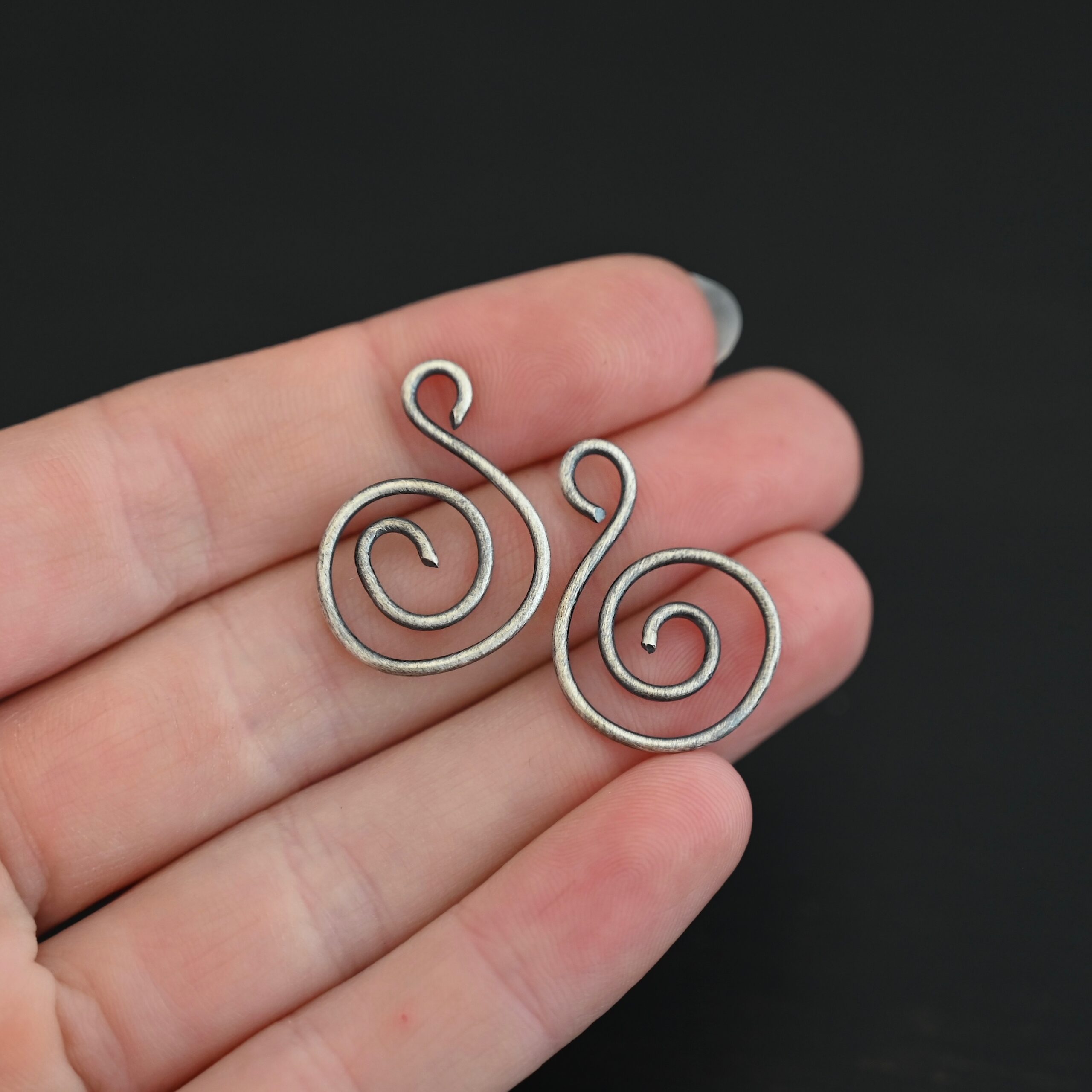 Sterling Silver Teagan S Shaped Pair - oxidized smooth shown in hand