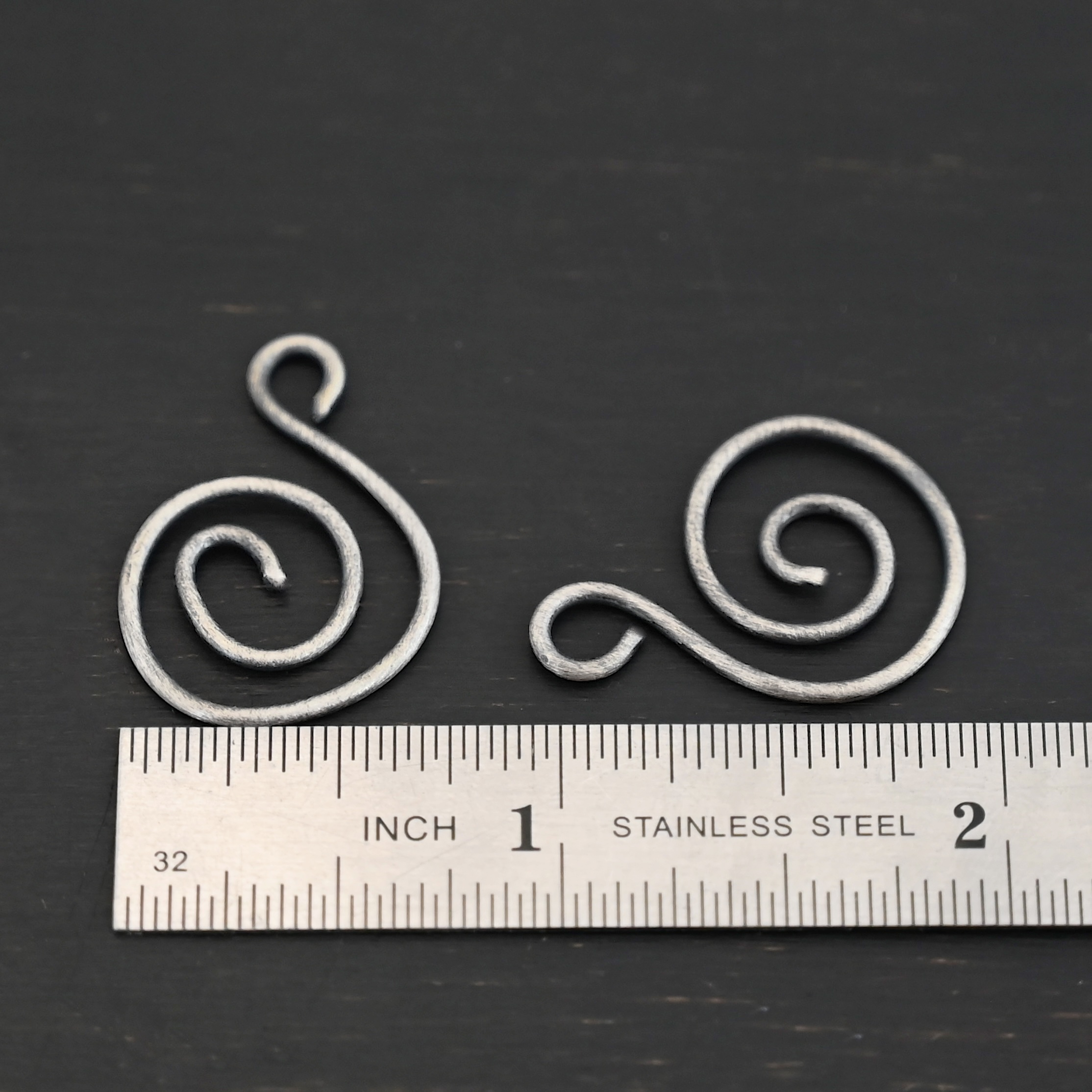 Sterling Silver Teagan S Shaped Pair - oxidized smooth shown by ruler