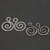 Sterling Silver Teagan S Shaped Pair - oxidized & shiny smooth shown on dark background