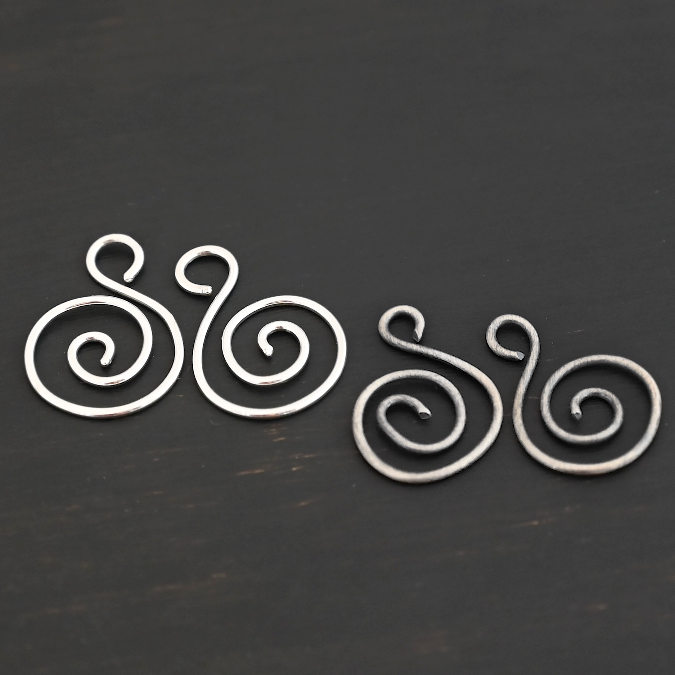 Sterling Silver Teagan S Shaped Pair - oxidized & shiny smooth shown on dark background