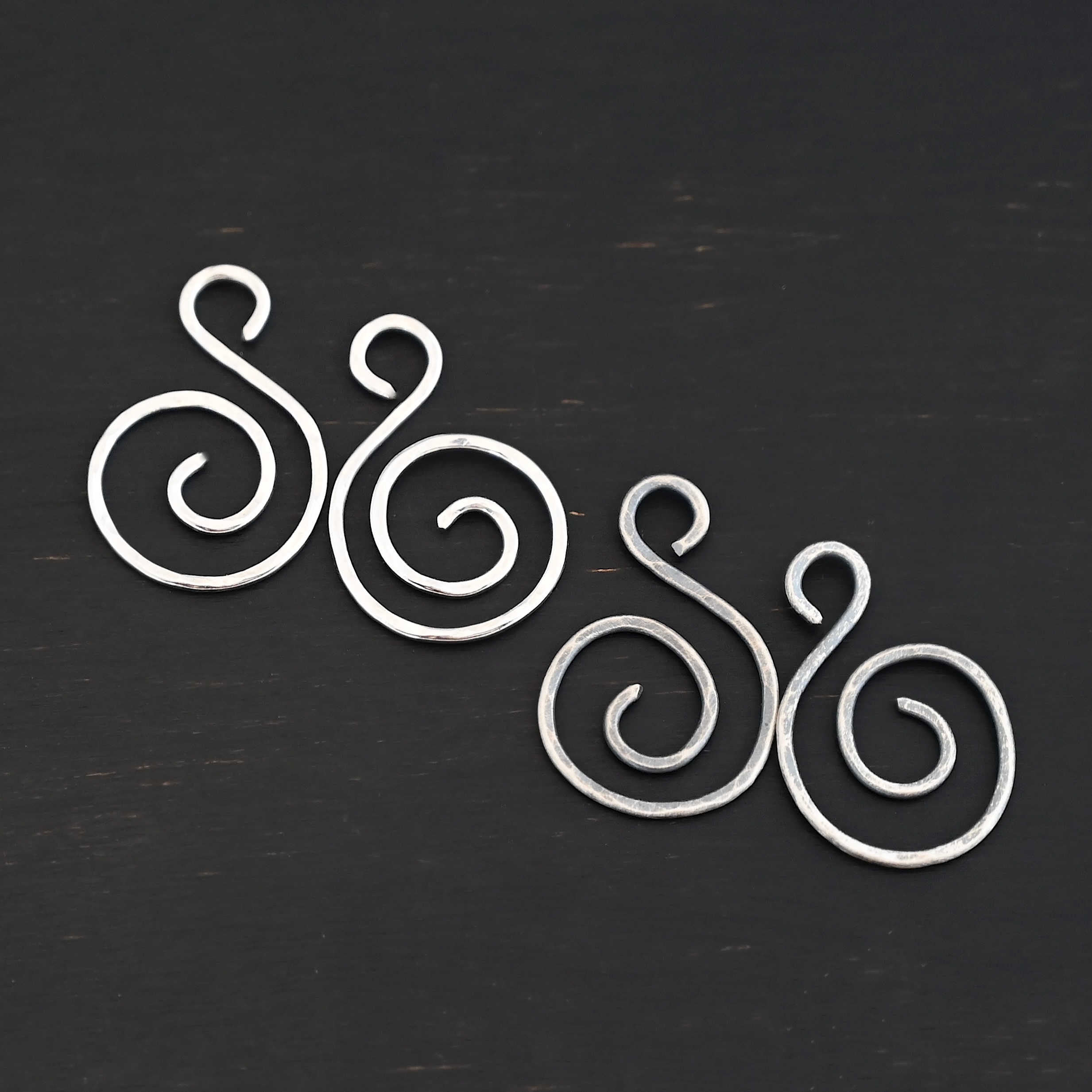 Sterling Silver Teagan S Shaped Pair - oxidized & shiny hammered shown on dark background