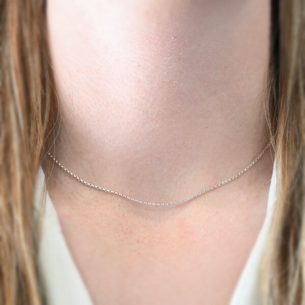 Sterling Silver Cassie Chain - 16-19" shiny shown on model with white shirt and brown hair