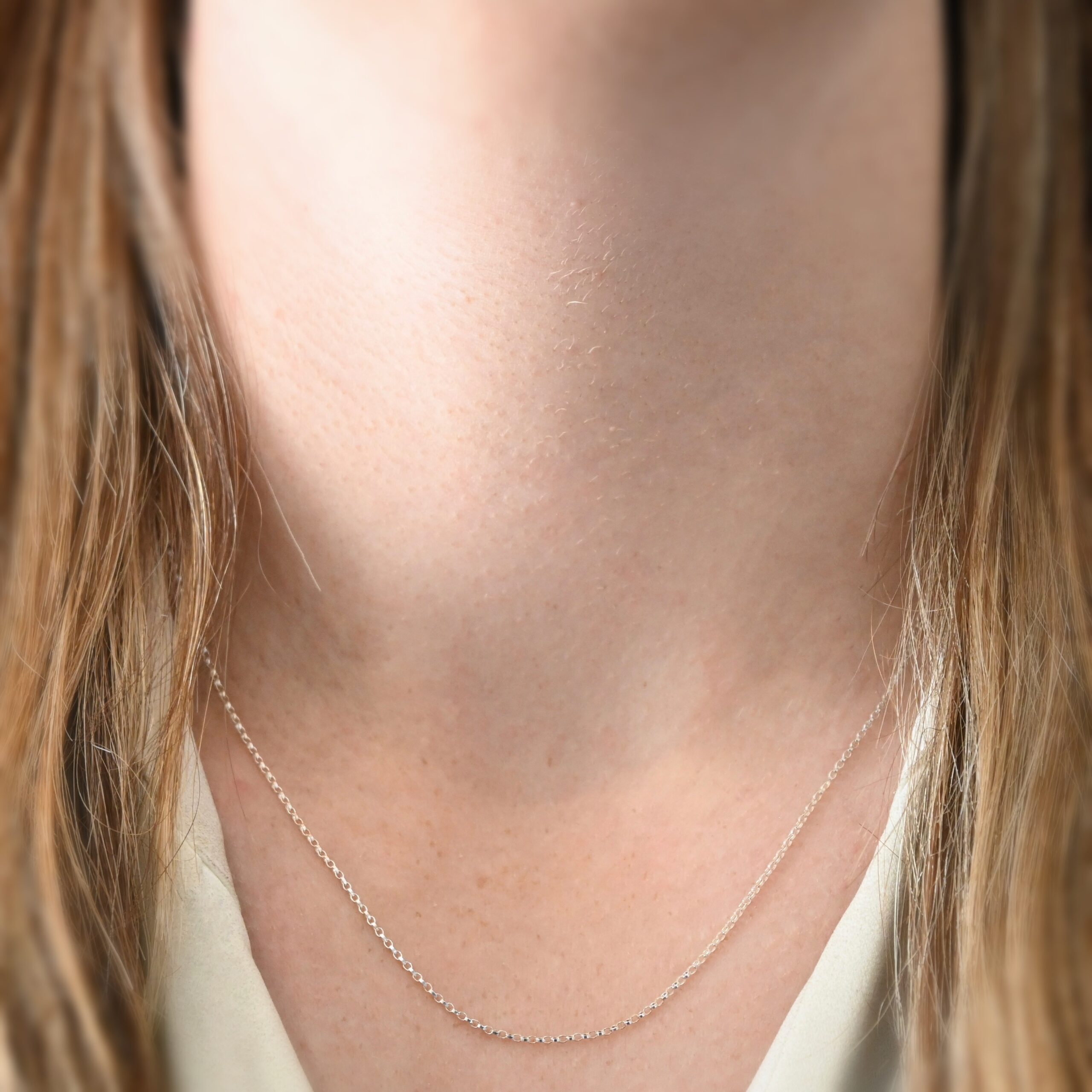 Sterling Silver Cassie Chain - 18-21" shiny shown on model with white shirt and brown hair