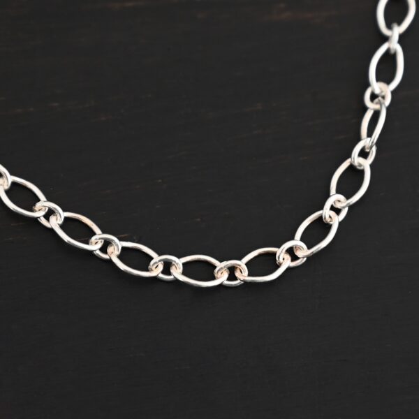 Allie Chain shiny shown on dark background