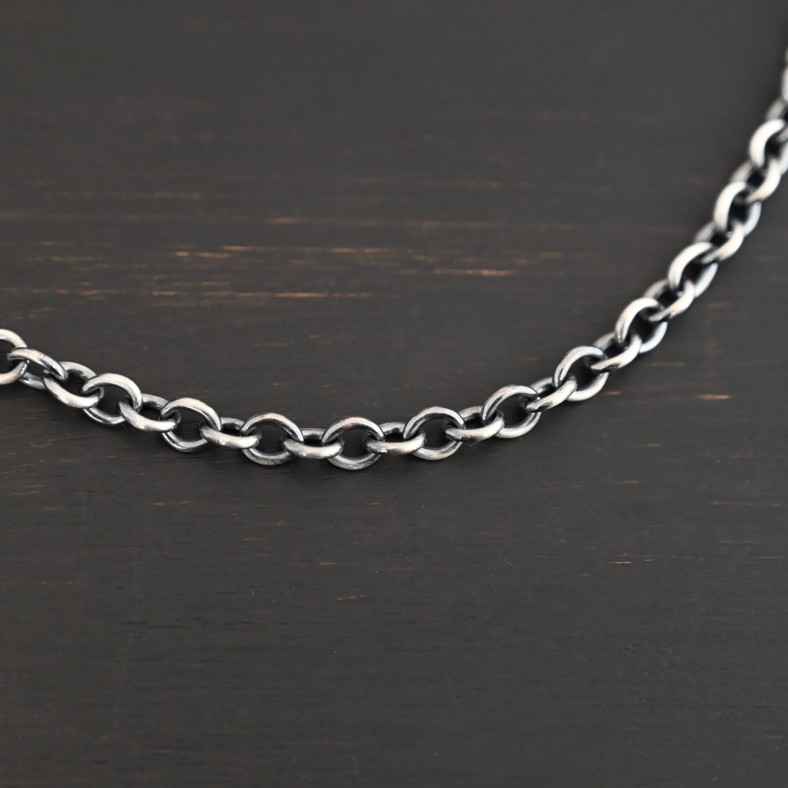 Joy Chain oxidized shown on dark background