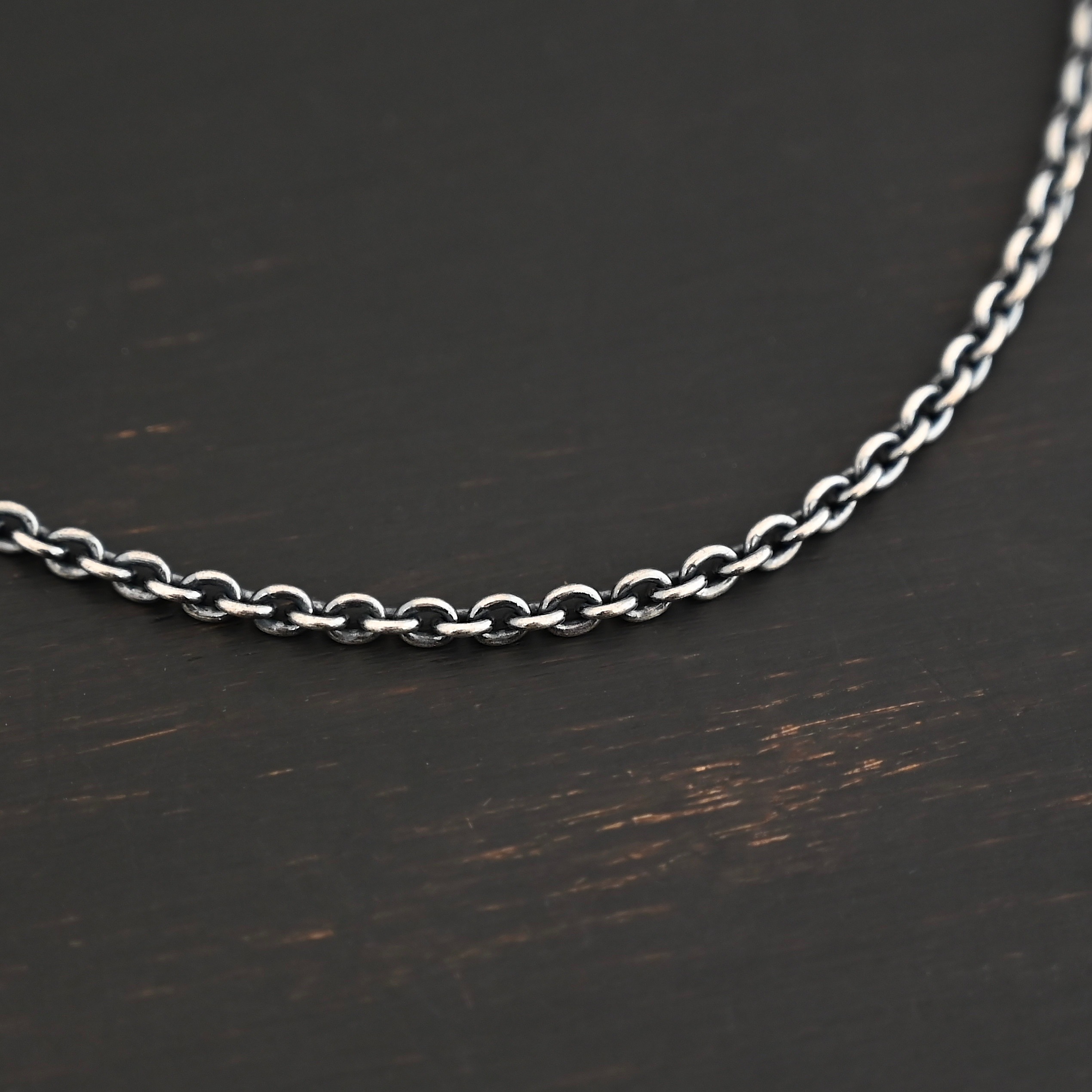 Maria Chain oxidized shown on dark background