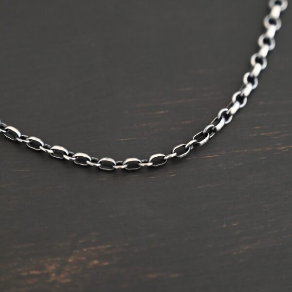 Olivia Chain oxidized shown on dark background