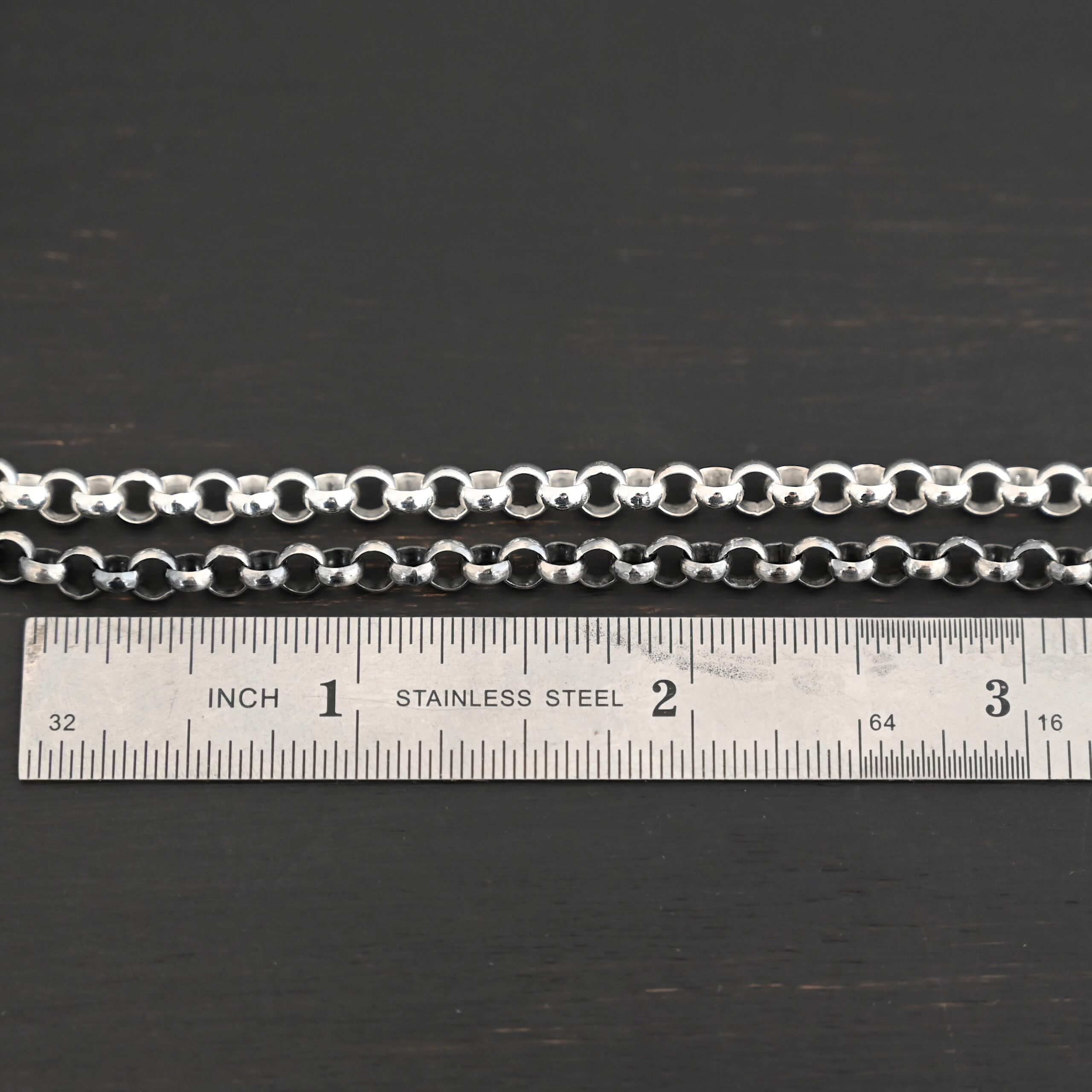 Roxy Rolo Chain oxidized & shiny shown by ruler