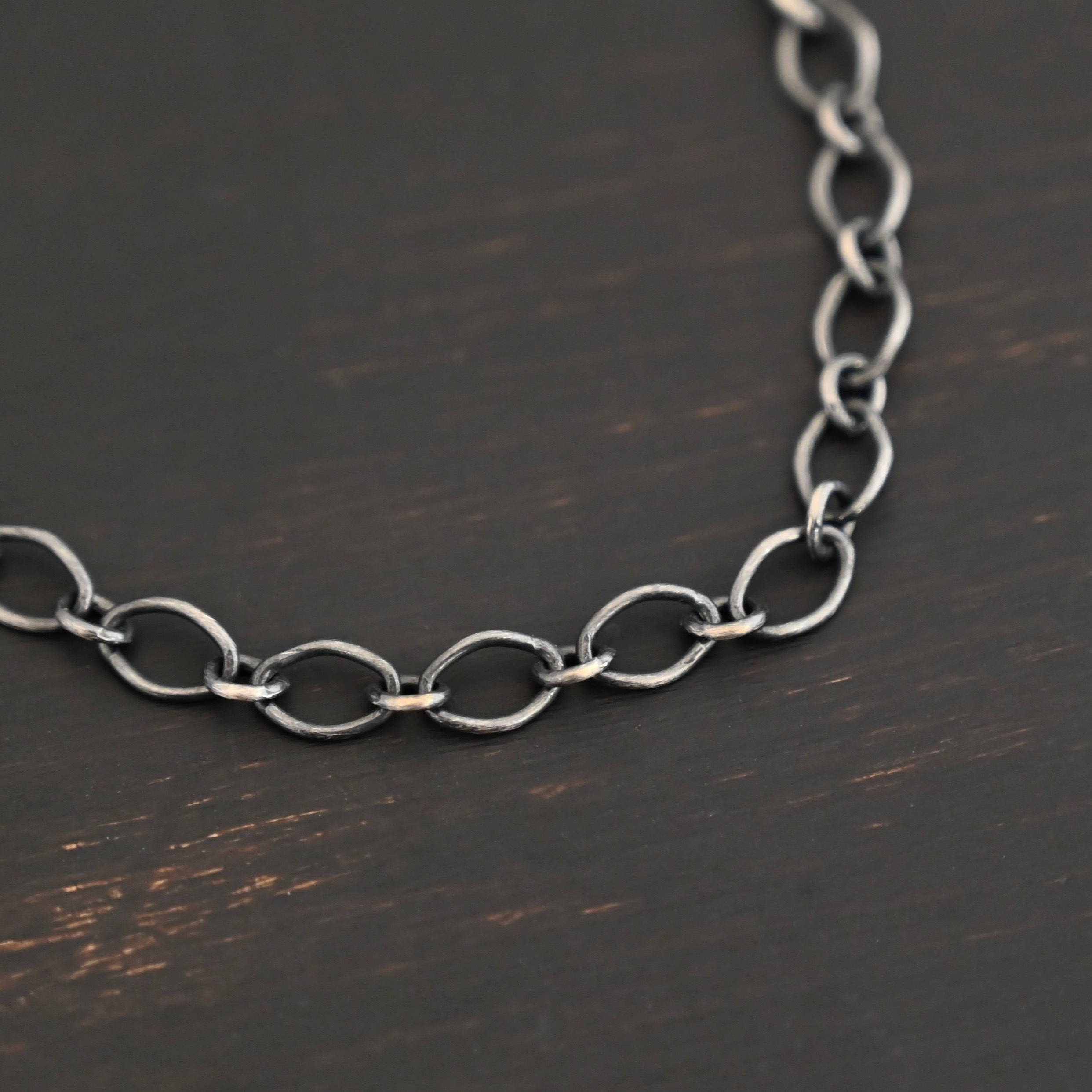 Allie Chain oxidized shown on dark background