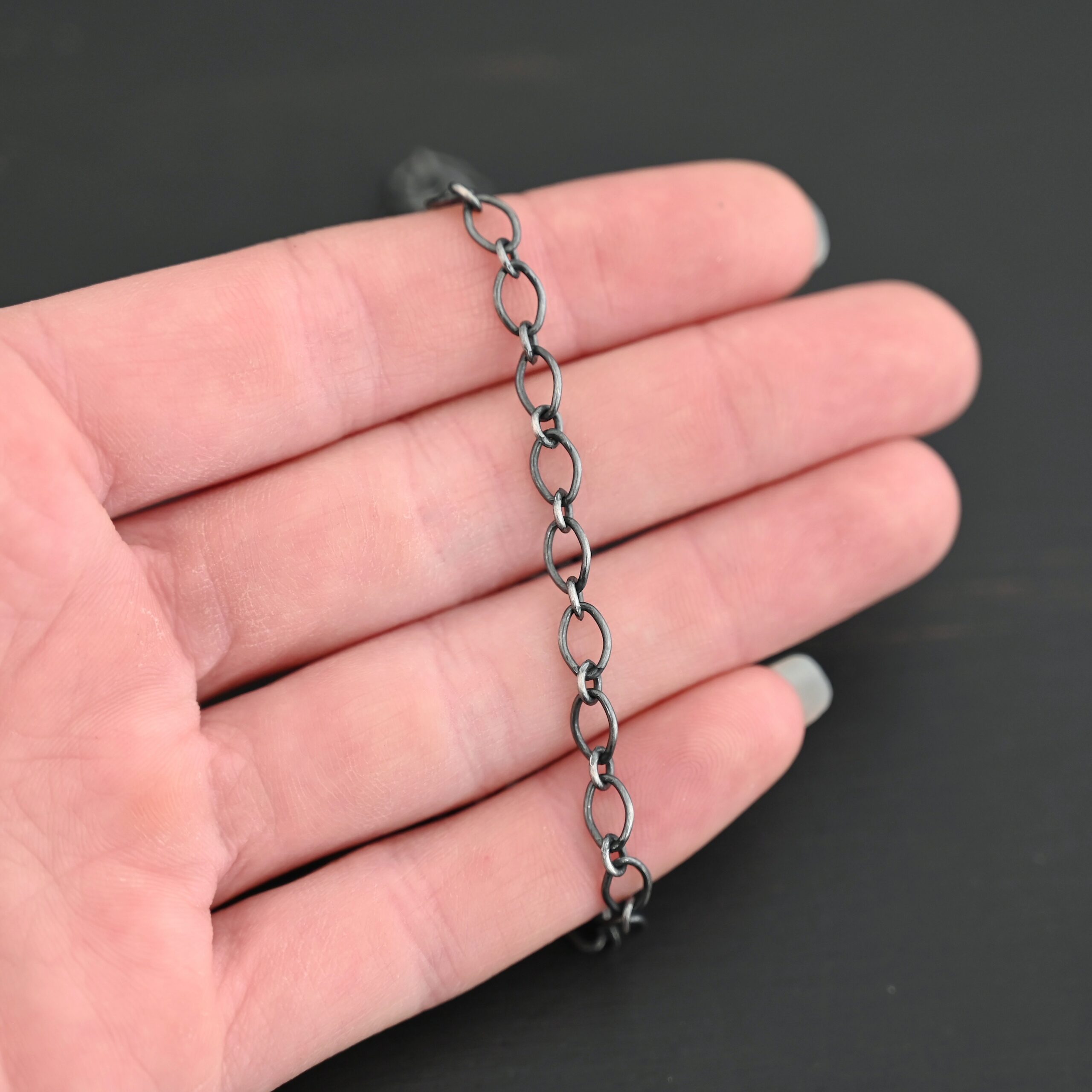 Allie Chain oxidized shown in hand